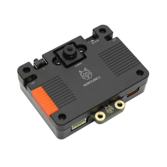 Angled top view of the HUSKYLENS 2 AI Vision Sensor showing the camera lens and sleek black casing.