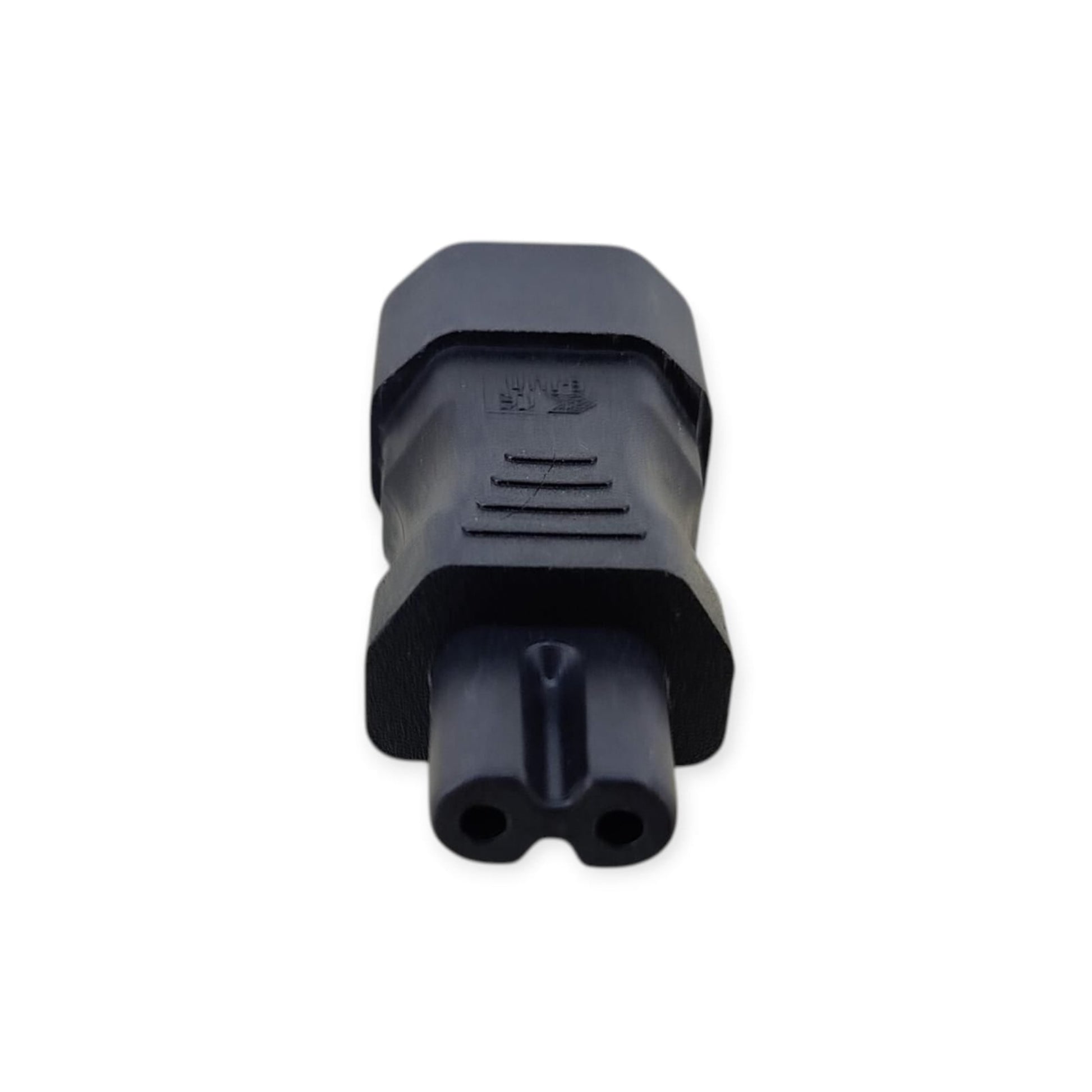 Close-up of the IEC C7 male (figure-8) plug on the power adapter.