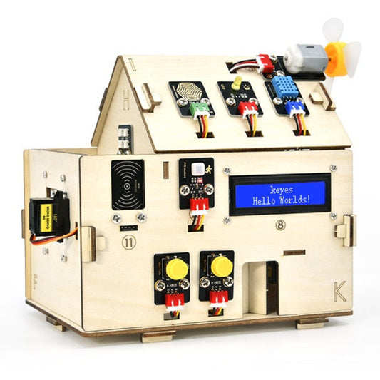 Assembled KEYES ESP32 IoT Smart Home Kit showing various sensors on a wooden house model.