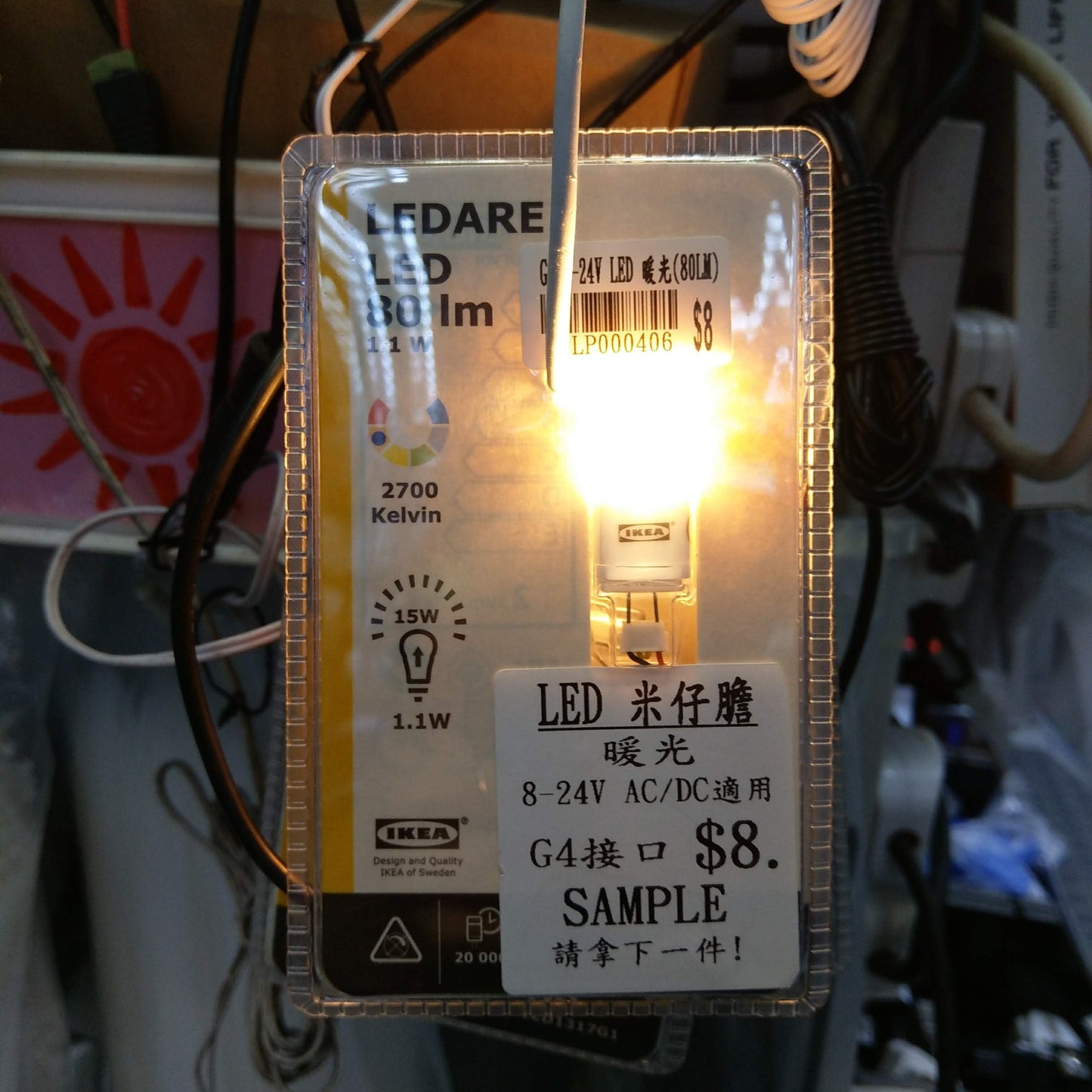 LEDARE G4 8-24V LED bulb illuminating a modern light fixture with warm glow.