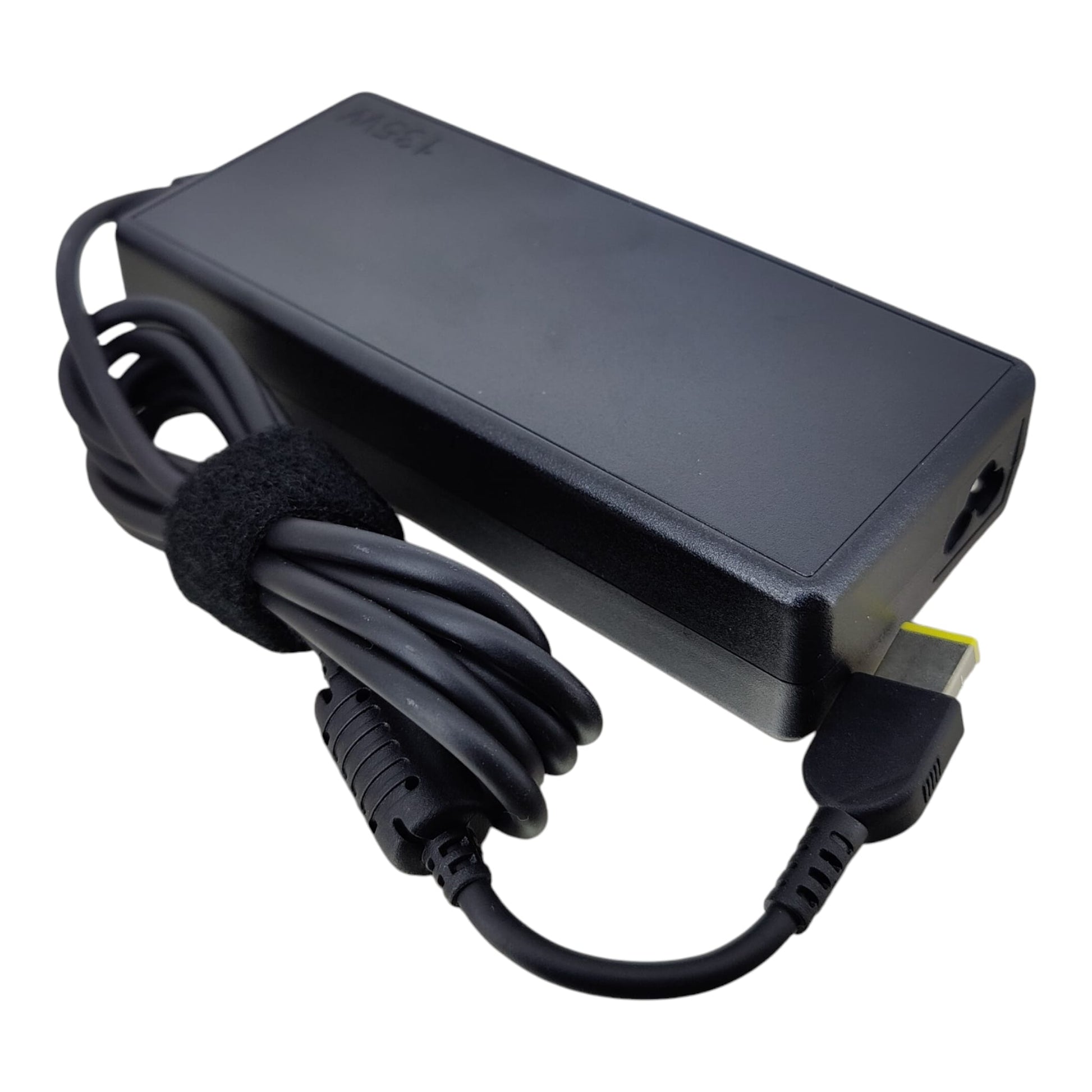 Top profile of the black Lenovo 135W power brick showing the slim design and fixed DC charging cable.