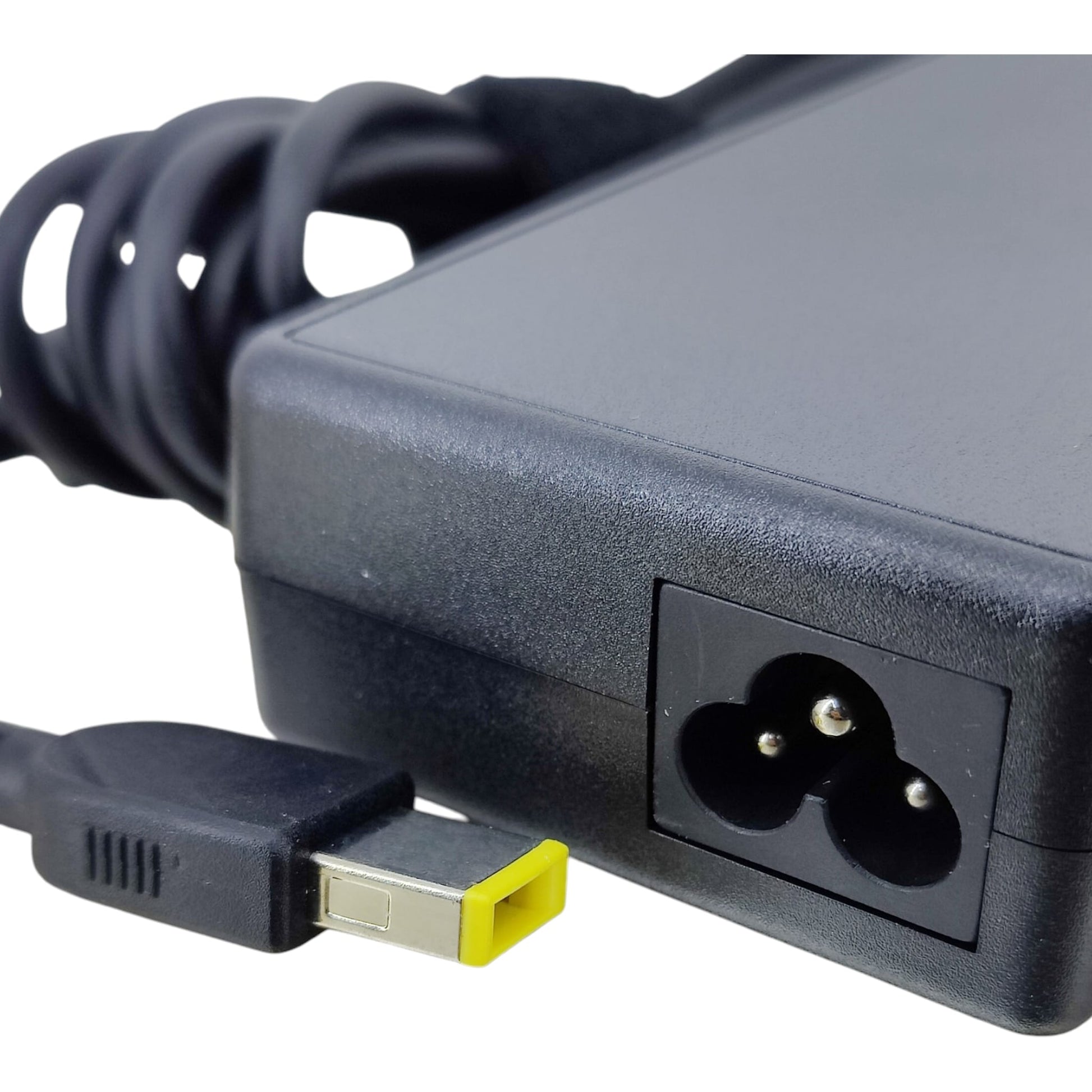 Close-up of Lenovo yellow square tip connector and the 3-prong C5 "Mickey Mouse" power inlet port.