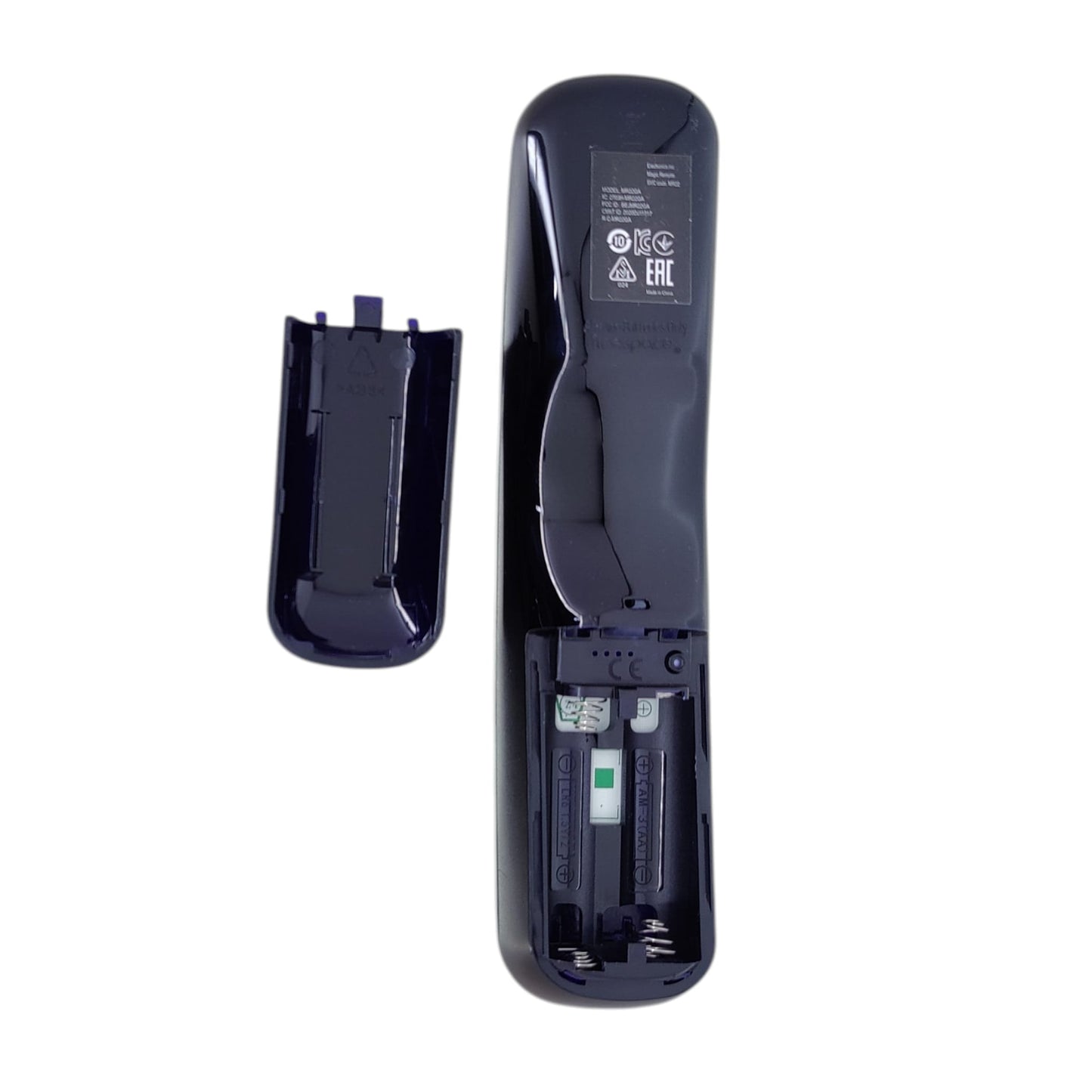 Back of LG replacement remote with battery cover removed showing dual AA battery slots.