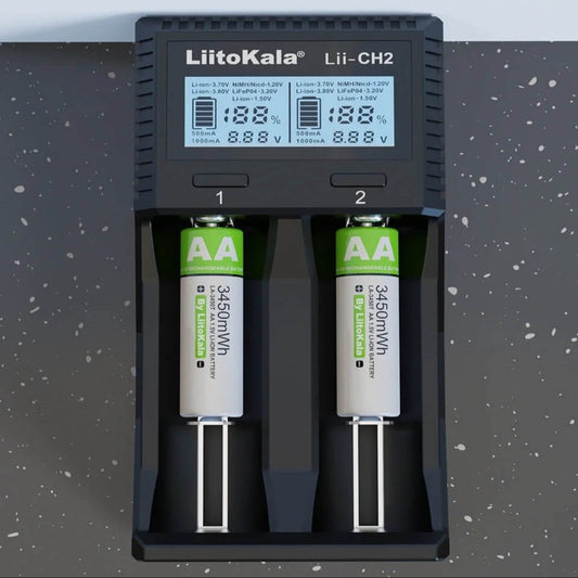 LiitoKala Lii-CH2 Smart Charger displaying charging status for AA batteries on a black countertop.