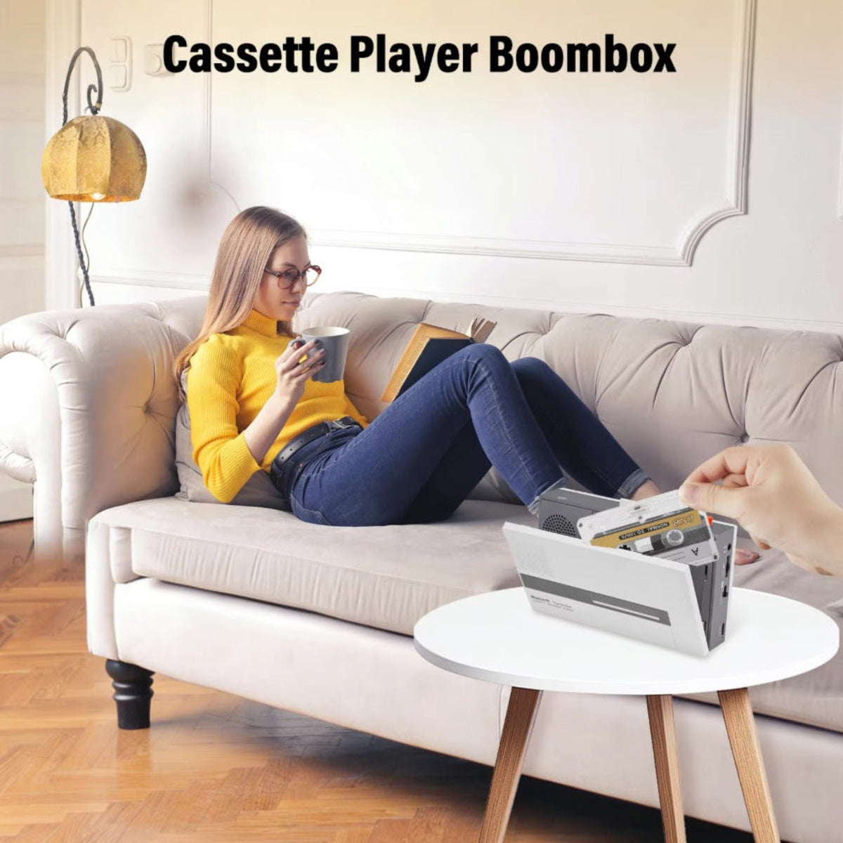 Loading a cassette tape into the portable retro boombox player on a living room table