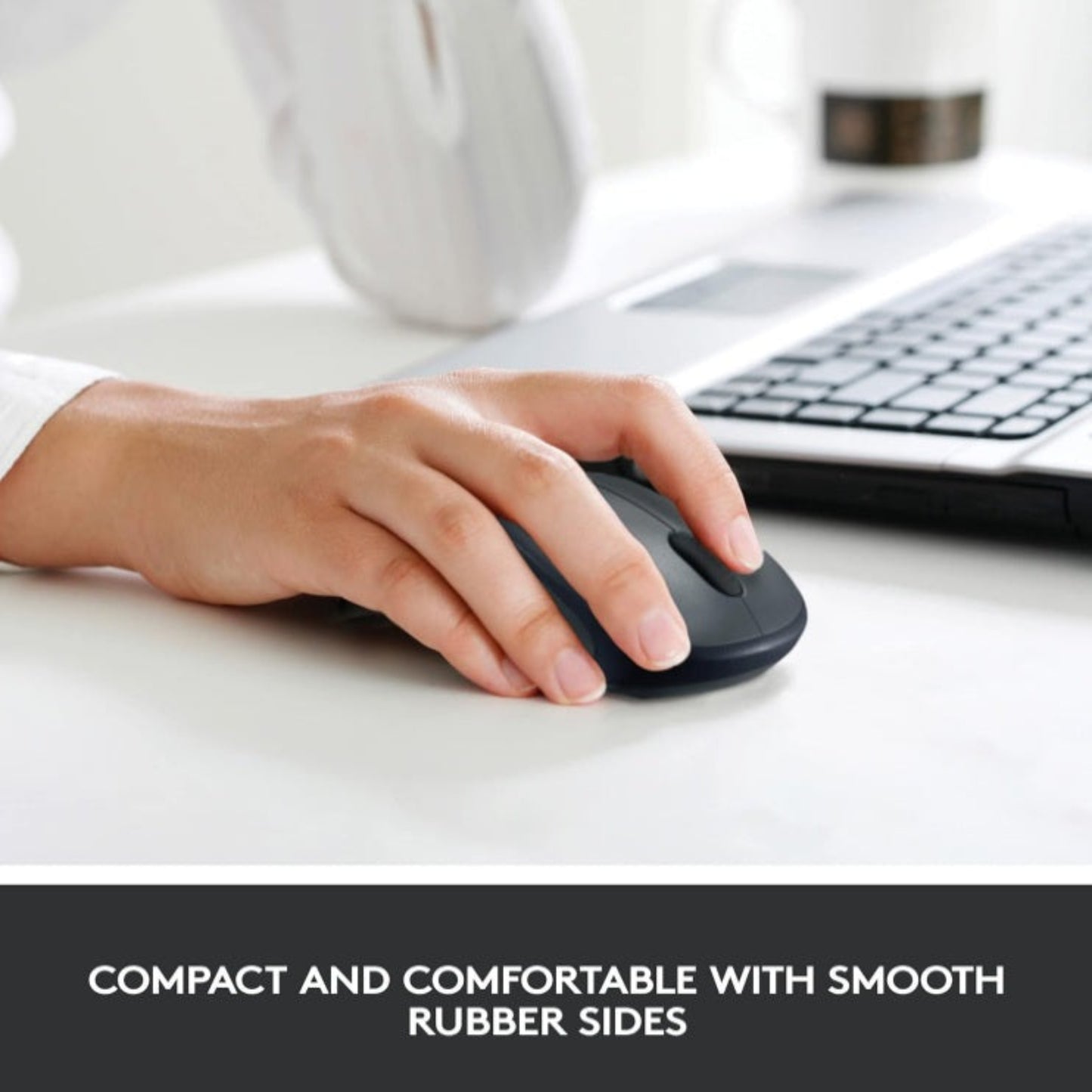 Close up of the Logitech M235 showing smooth rubber side grips and ergonomic design.