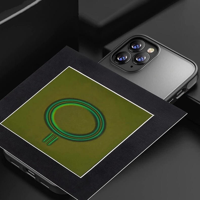 4x4 inch magnetic field viewing film beside a smartphone, showcasing magnetic flux visualization patterns.