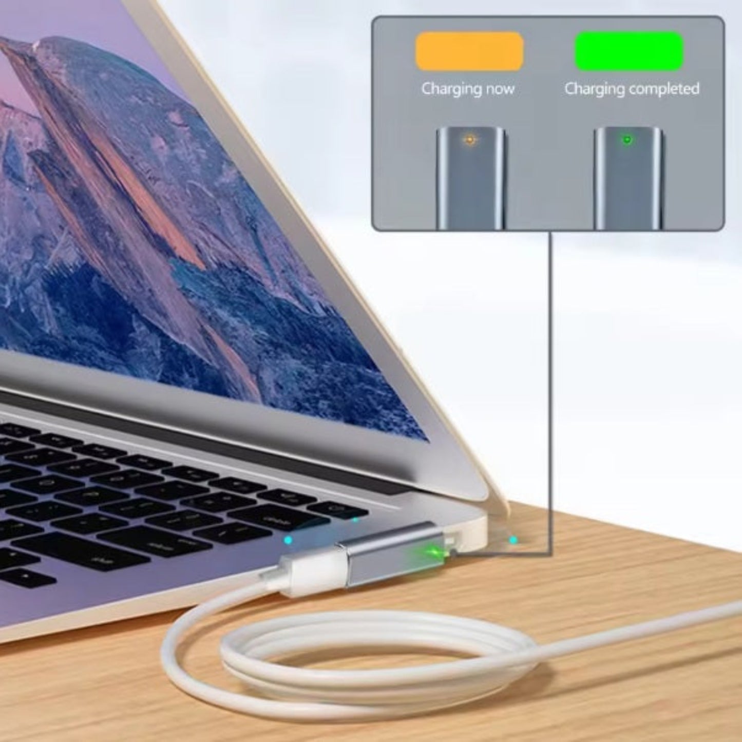 The USB-C to MagSafe 2 adapter plugged into a MacBook, with a diagram showing the orange (charging) and green (completed) indicator lights.