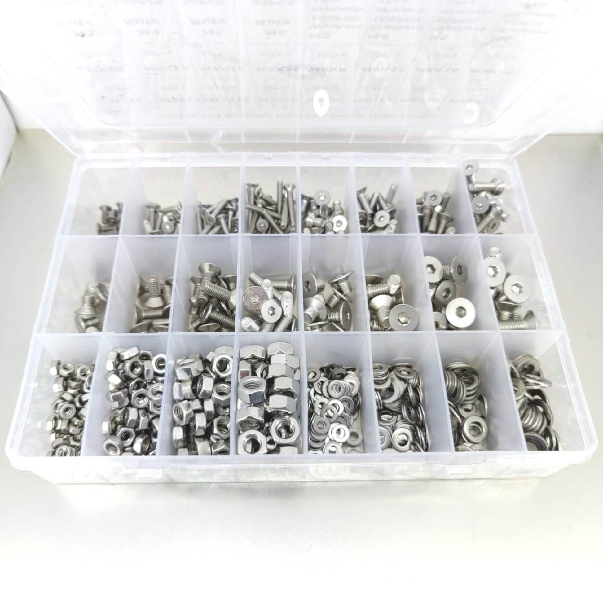 Organized box of metric countersunk bolts, nuts, and washers with hex wrenches.