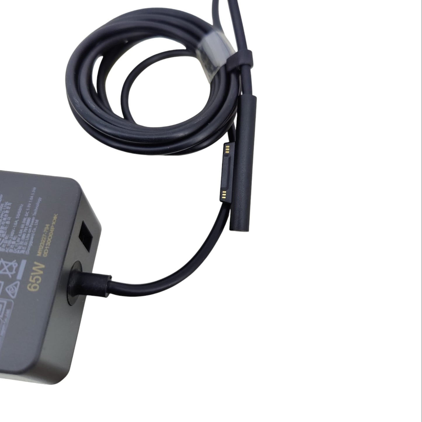 Close up of the magnetic Surface Connect interface on the 65W charger.