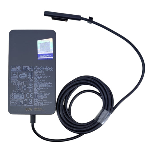 Top view of genuine Microsoft Surface 65W power adapter model 1706 with cable.