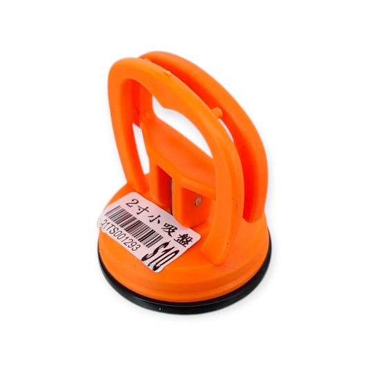 Mini suction cup dent puller and screen removal tool with a price tag.