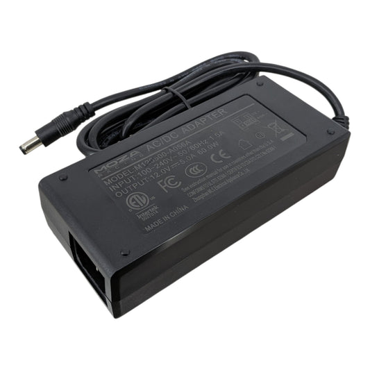 Top view of the MOZA 12V 5A AC/DC power adapter showing the M120500-A056A model label, 60W output specs, and safety certifications.