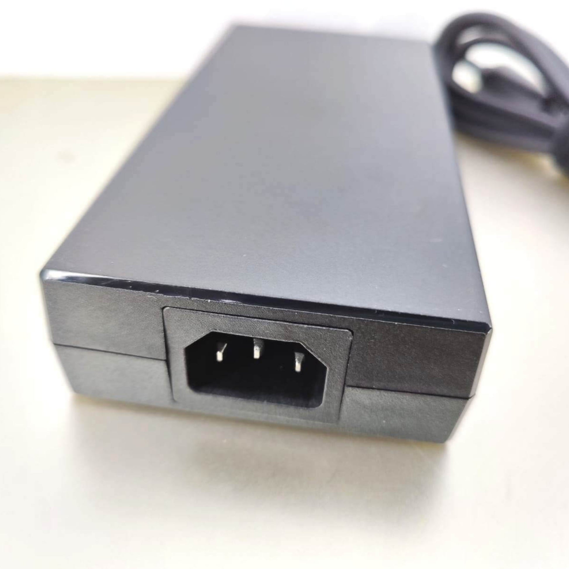 MSI laptop charger 230W, 19.5V 11.8A, featuring the AC power input port for connection.