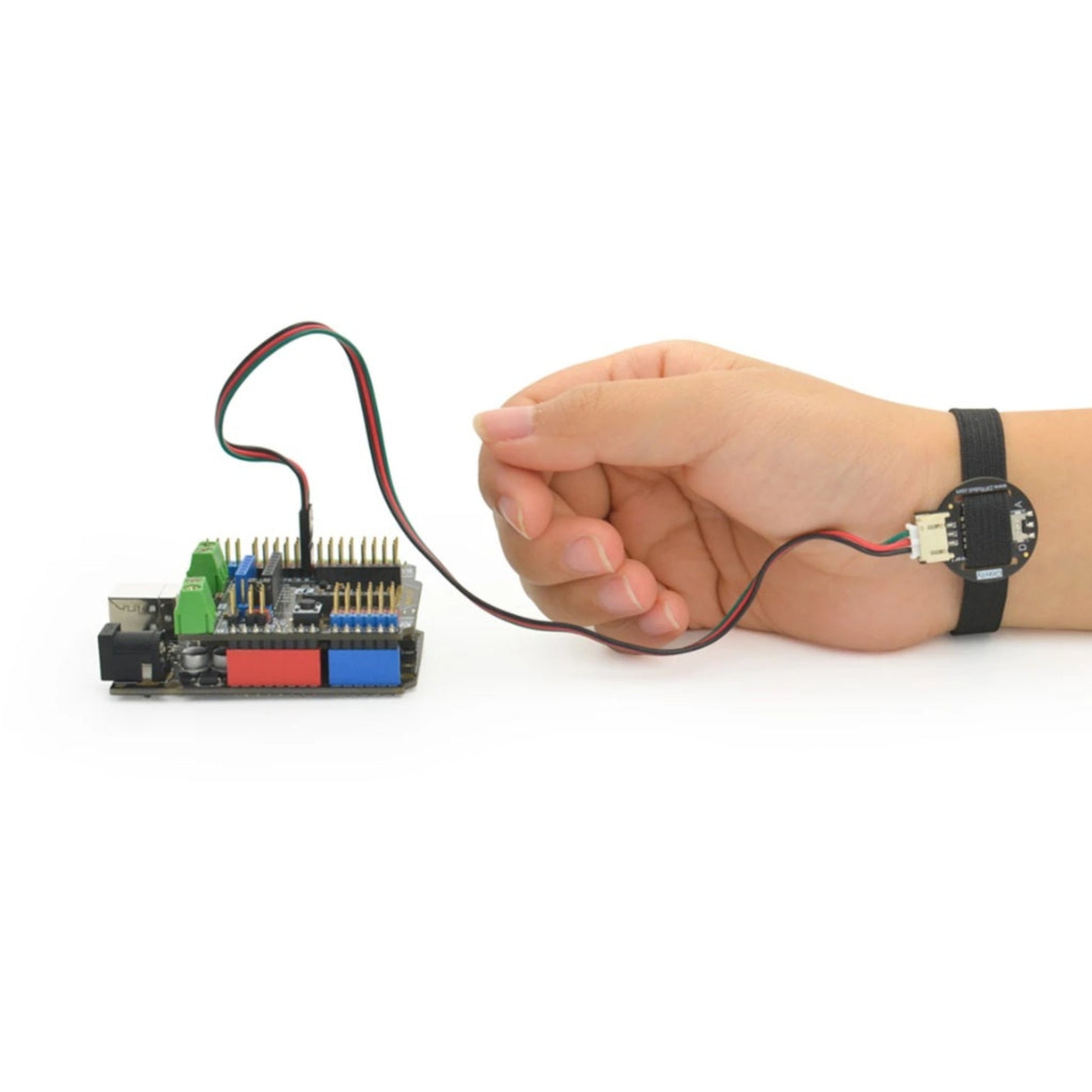 Bottom view of the PPG heart rate sensor showing the optical LED and detector used to measure blood volume changes in the skin.