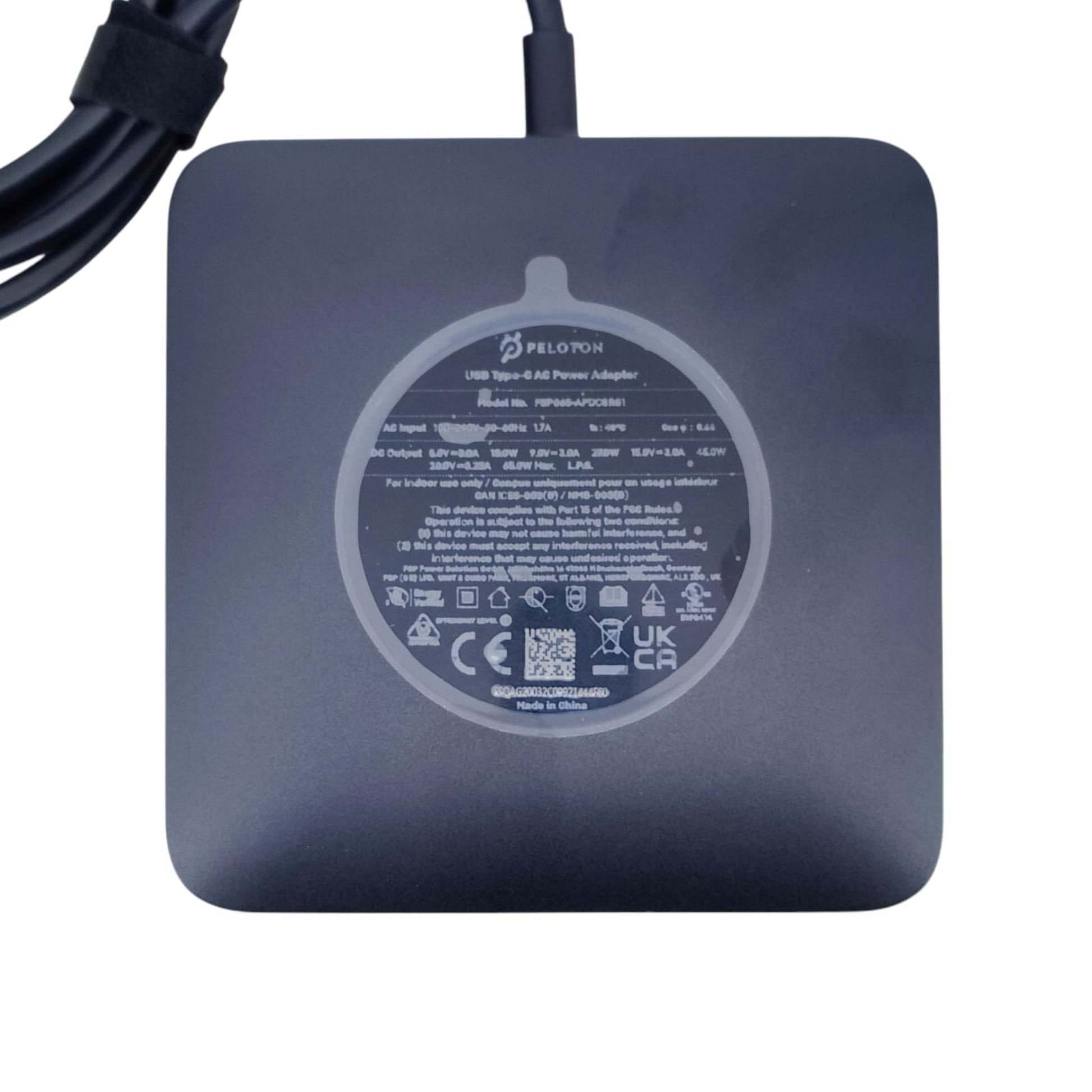 Bottom label of Peloton 65W USB-C Power Adapter (Model PSP04A) displaying output specifications.