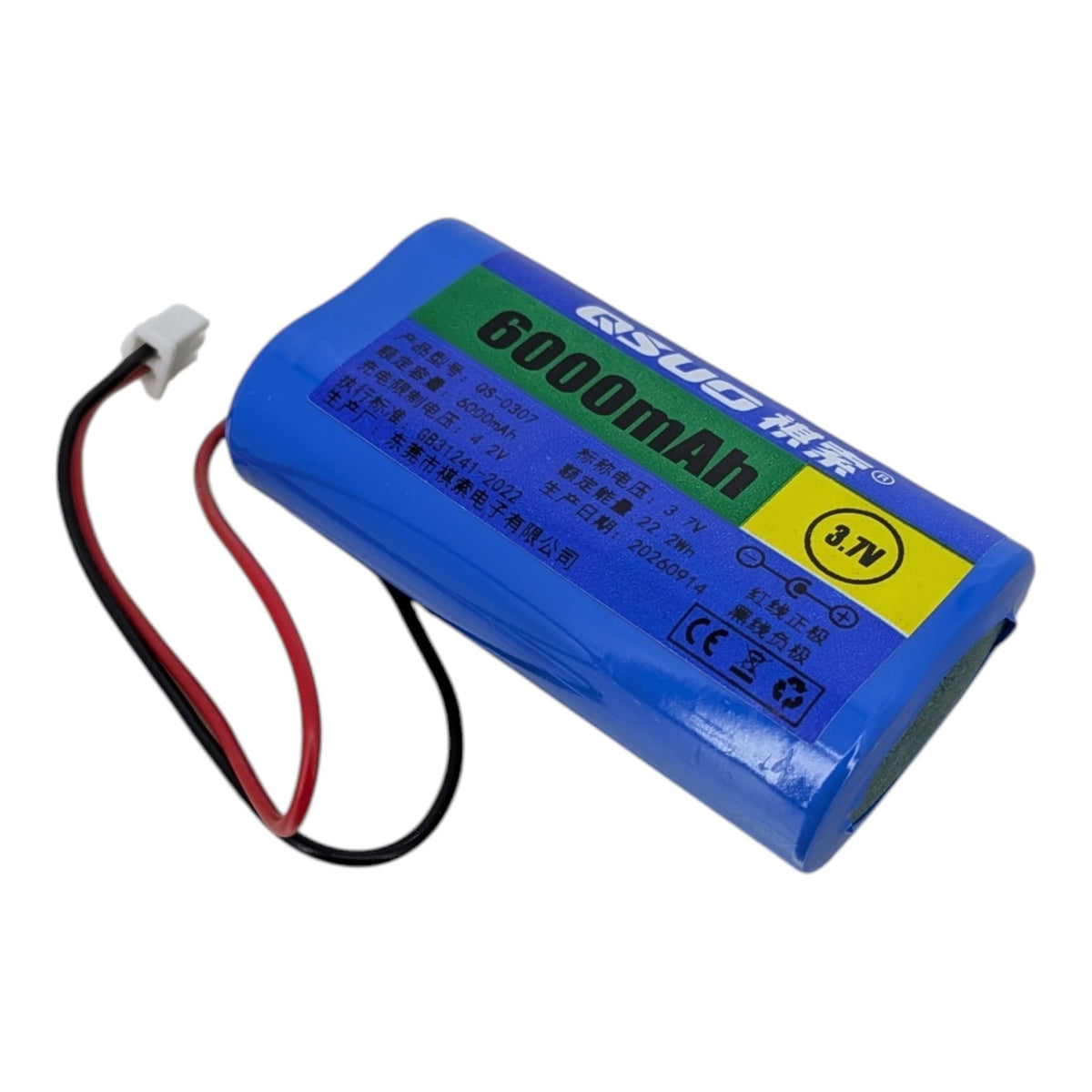 電池上的規格標籤，清晰列明 6000mAh 容量、3.7V 標稱電壓，以及 4.2V 充電限制的警告字句。