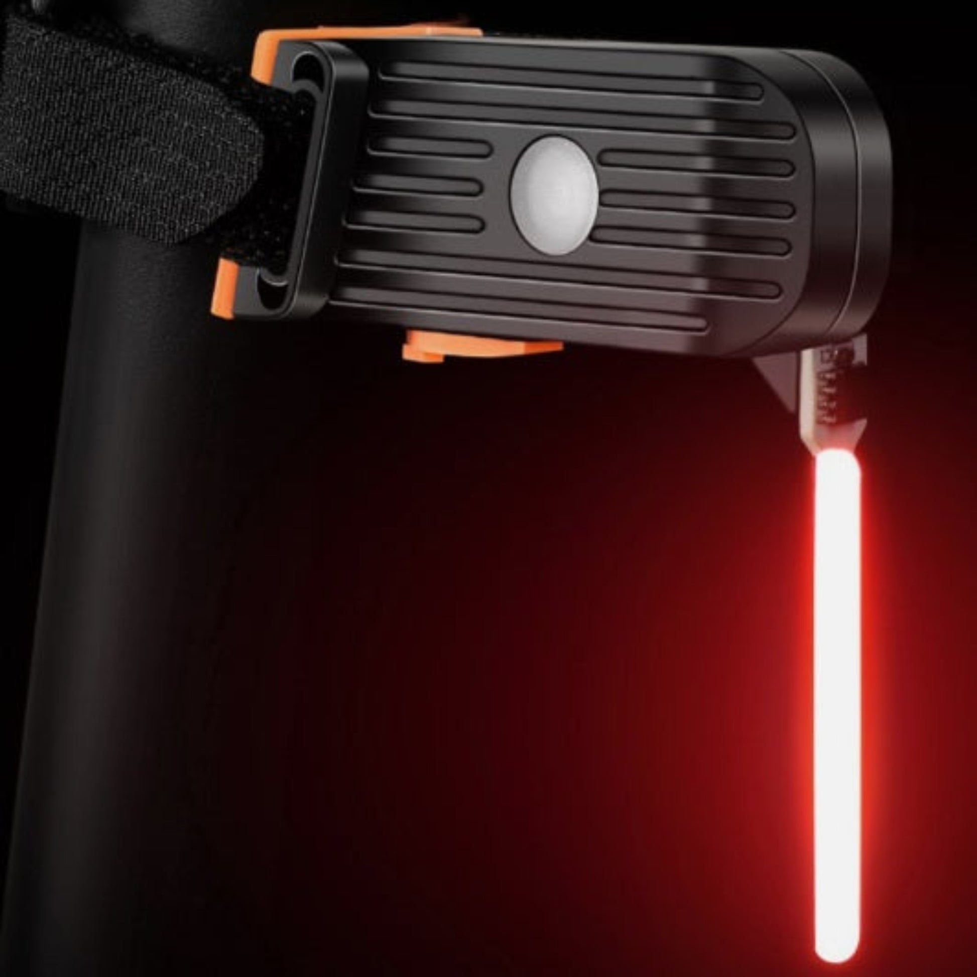A bright red LED bicycle tail light attached to a bike's seat post, highlighting its long, luminous design for safety.