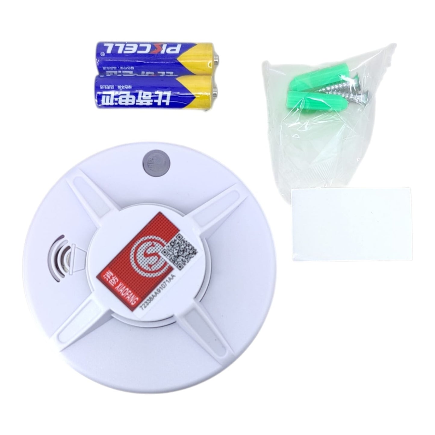Smoke detector package contents including AA batteries and mounting screws