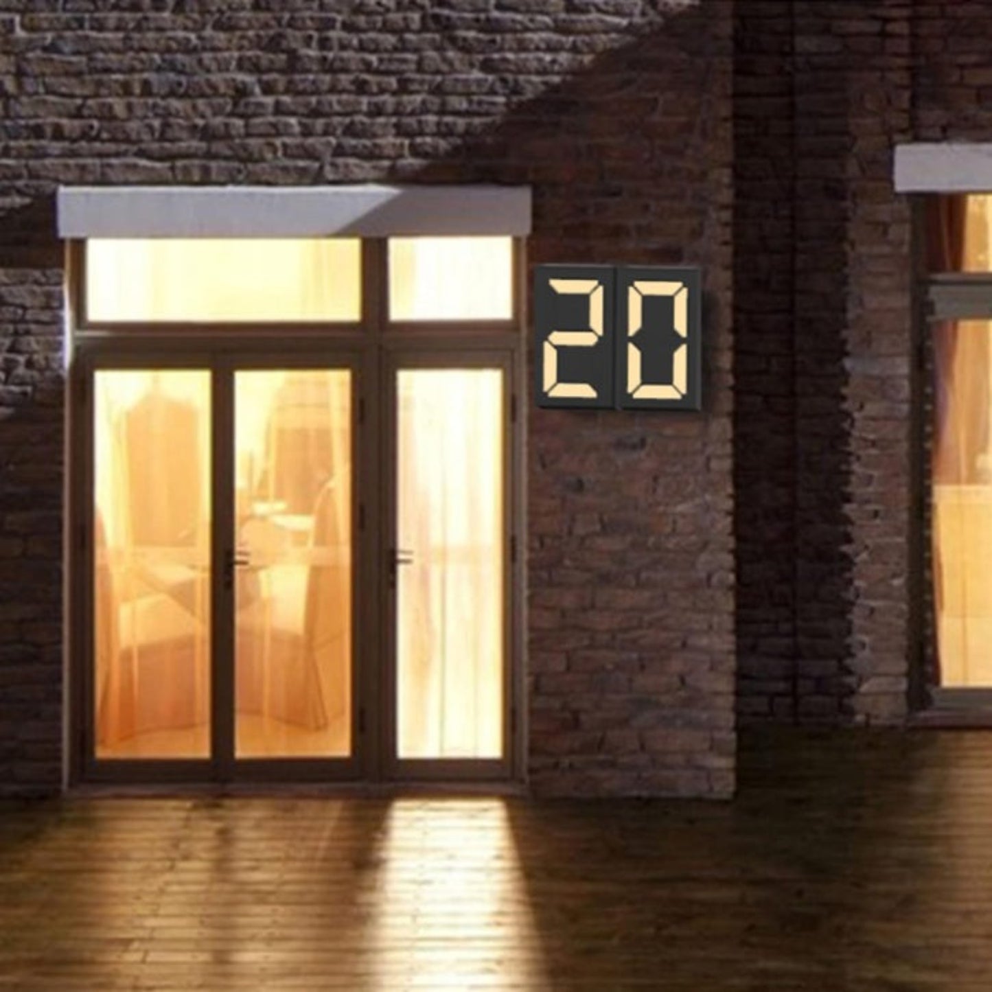 Glowing number 20 solar LED house number light installed on an outdoor brick wall at night.