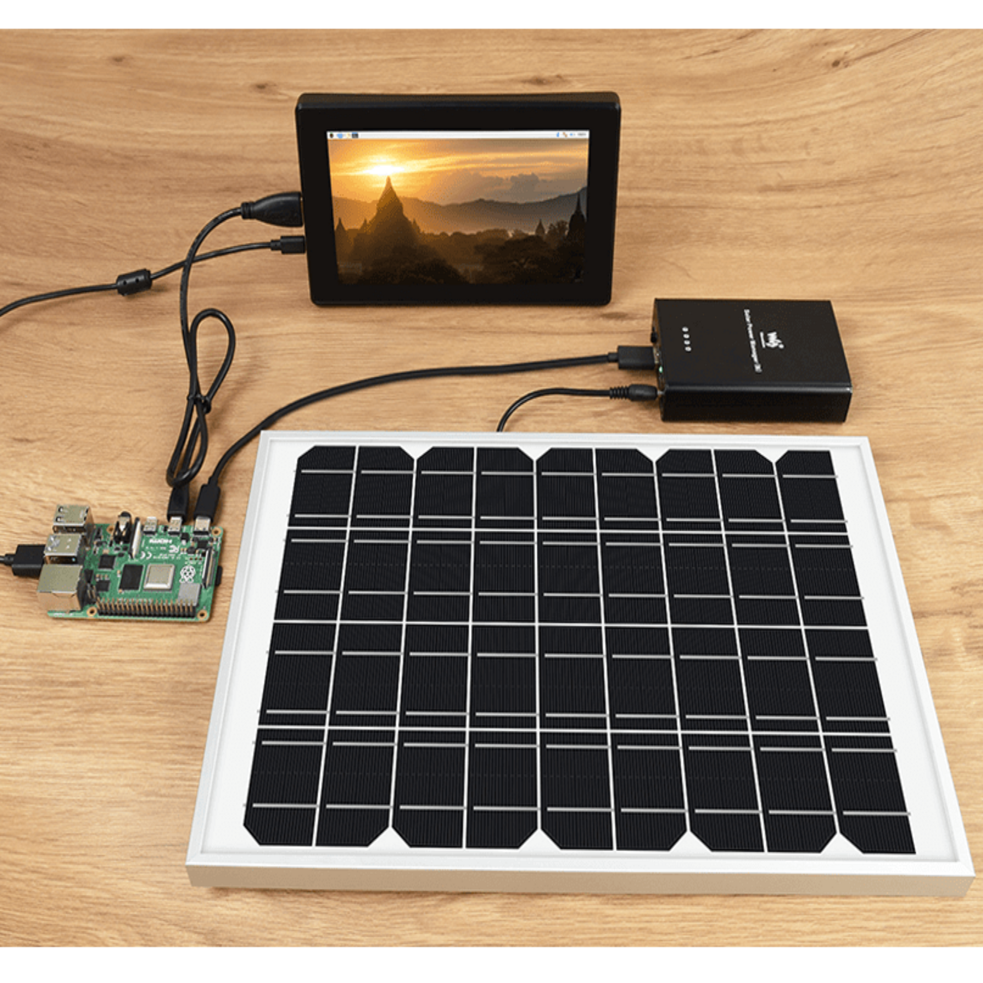 Full solar power kit: Solar Power Manager (B) powering a Raspberry Pi and monitor.