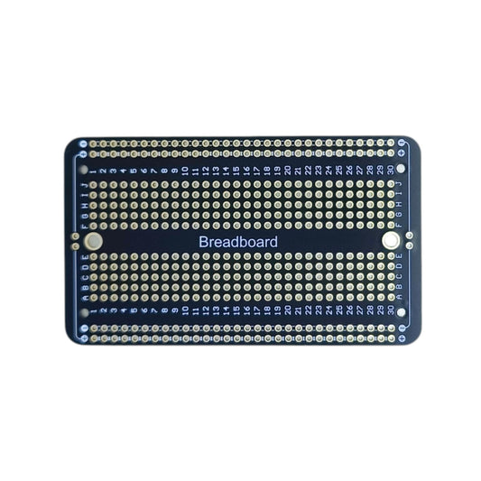 Front view of black PCB with breadboard-style layout, showing A–J columns and power rails for prototype soldering.