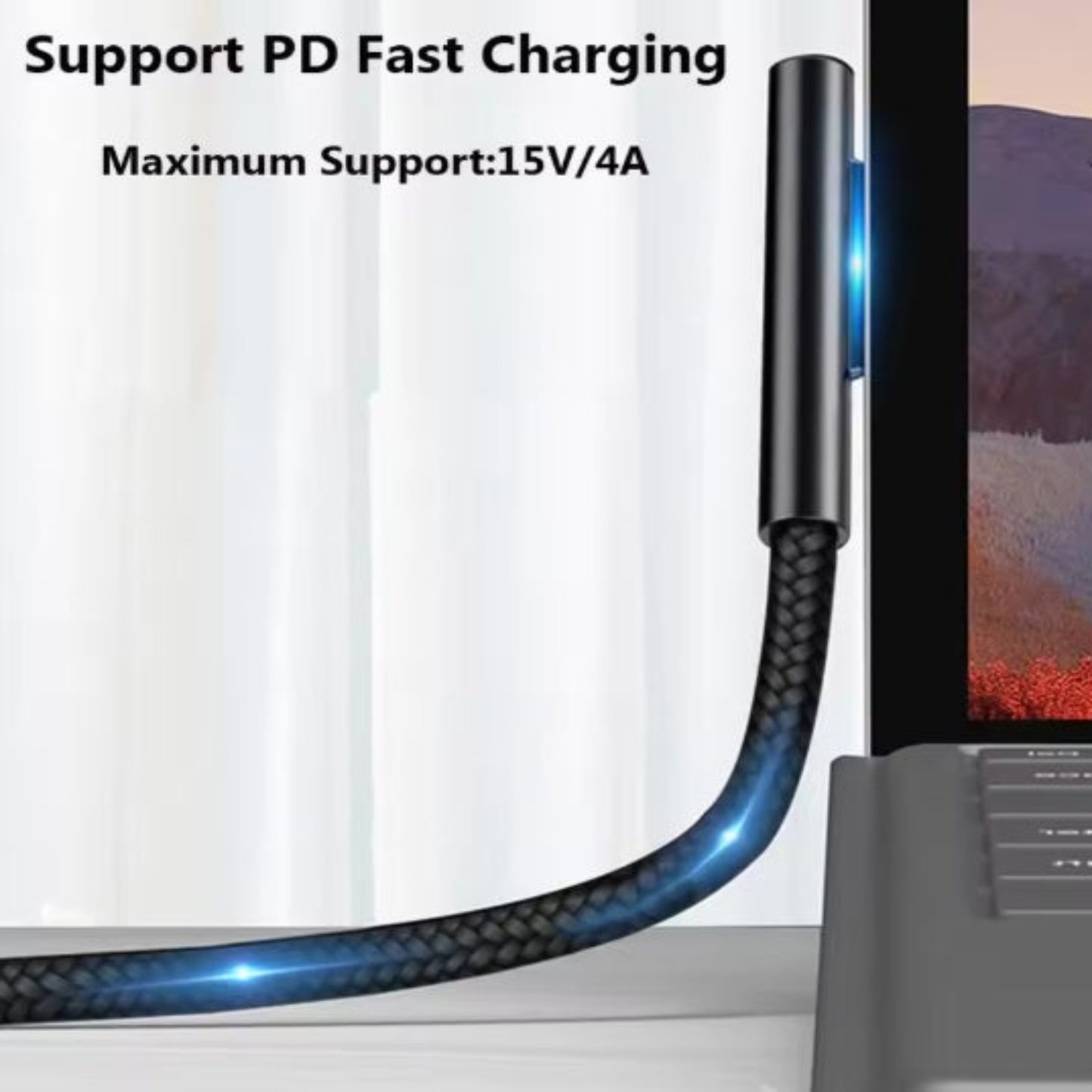 Magnetic charging connector plugged into Surface laptop displaying PD fast charging support.