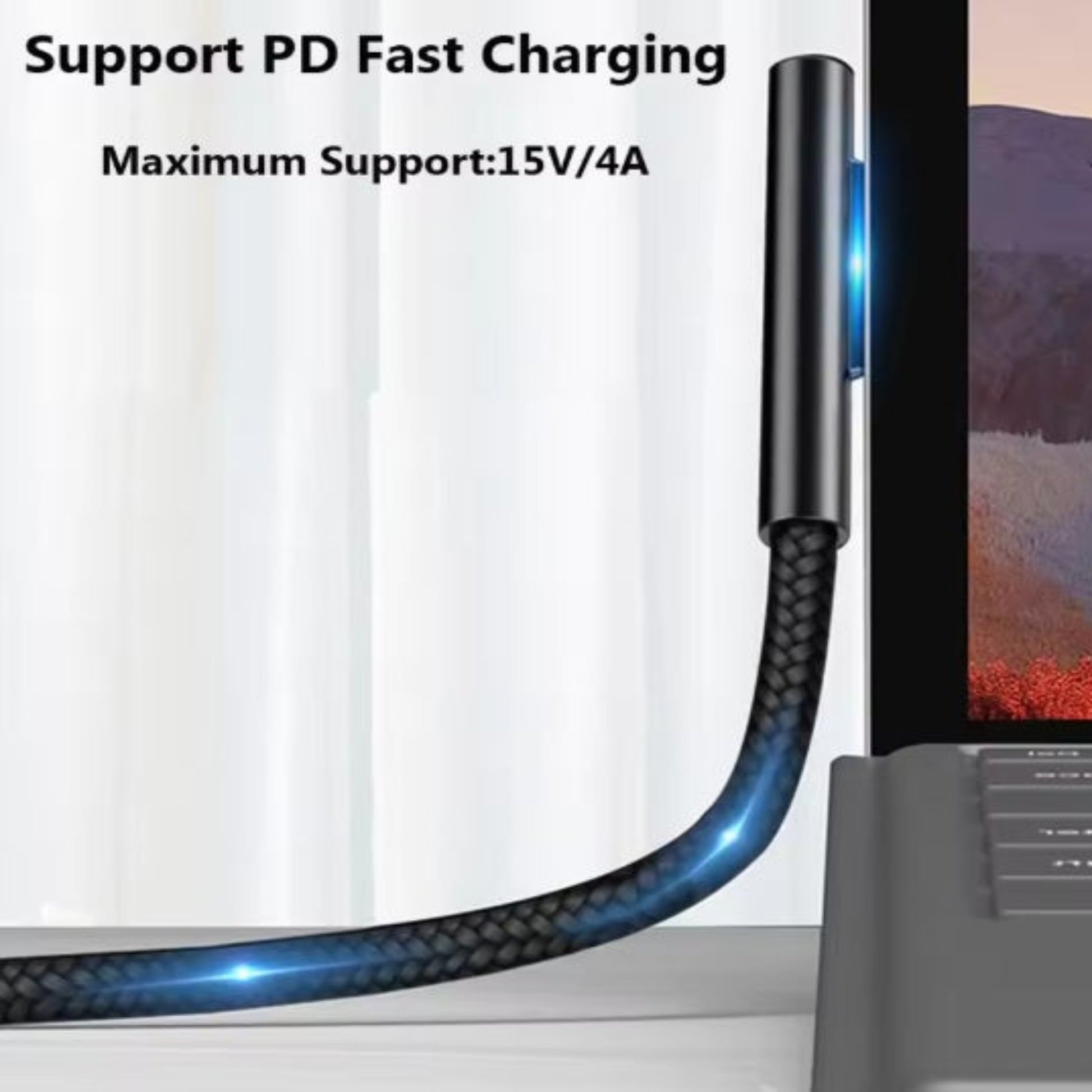 Magnetic charging connector plugged into Surface laptop displaying PD fast charging support.