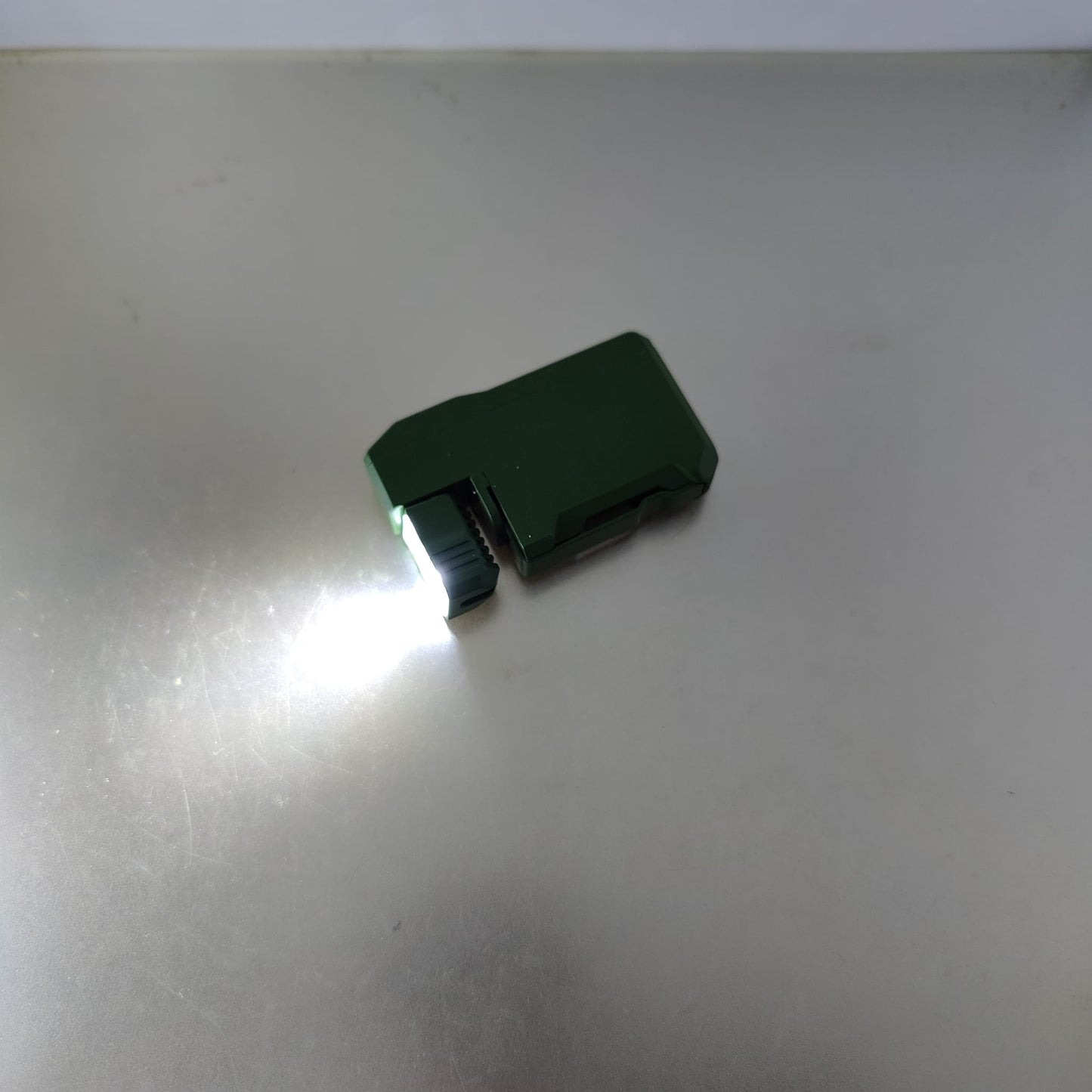 Angled view of the tactical black EDC pocket light showing the dual LED bulb configuration.