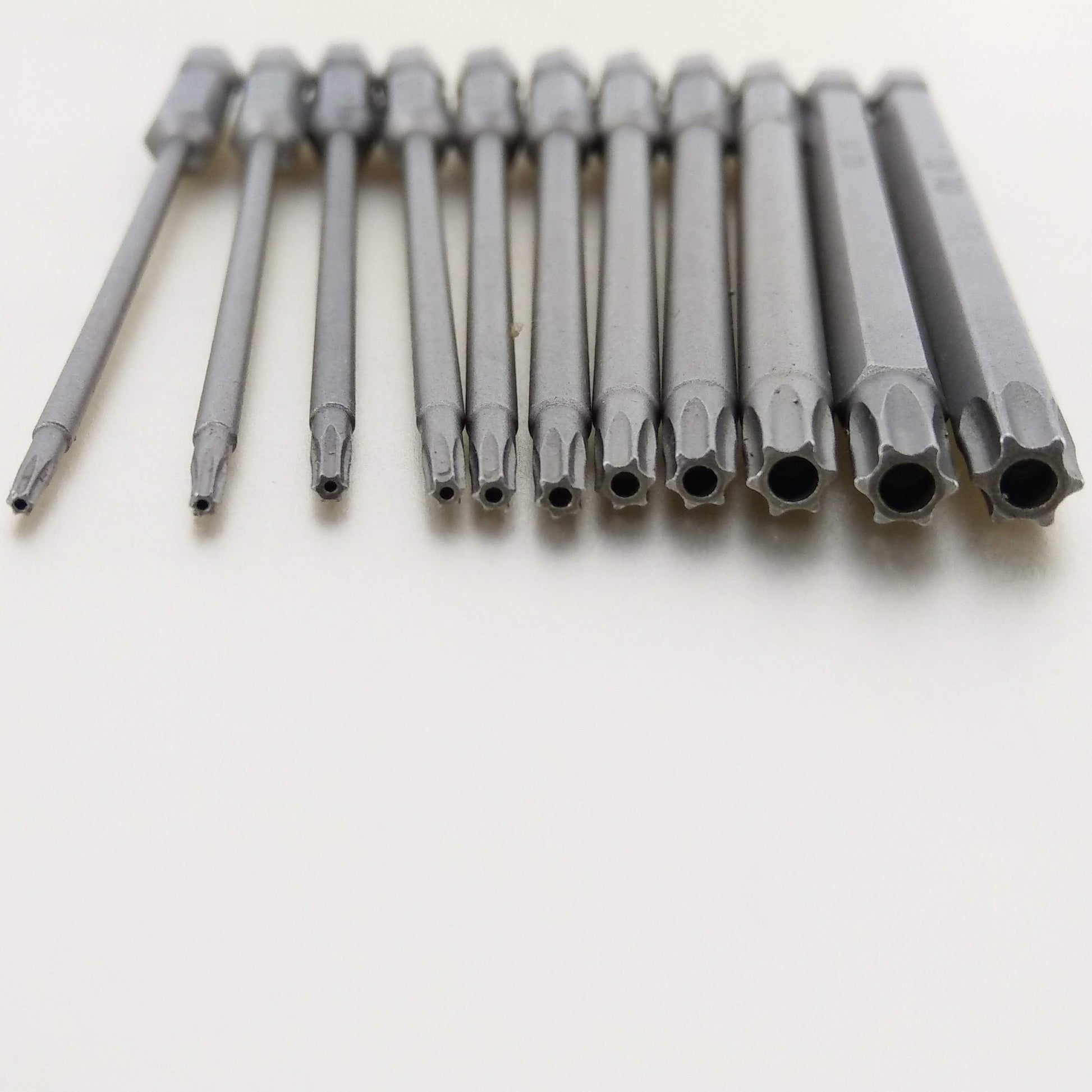 A close-up view showing the various sizes and hollow tips of the tamper-proof security Torx screwdriver bits.