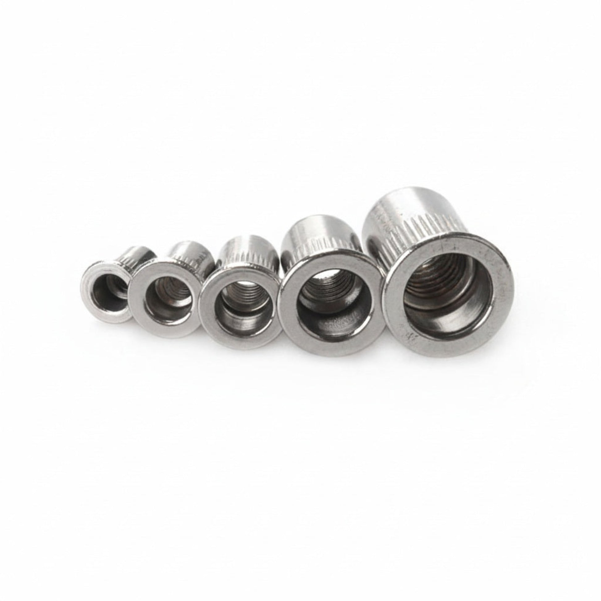 Top down view of stainless steel threaded rivet nuts showing internal threads
