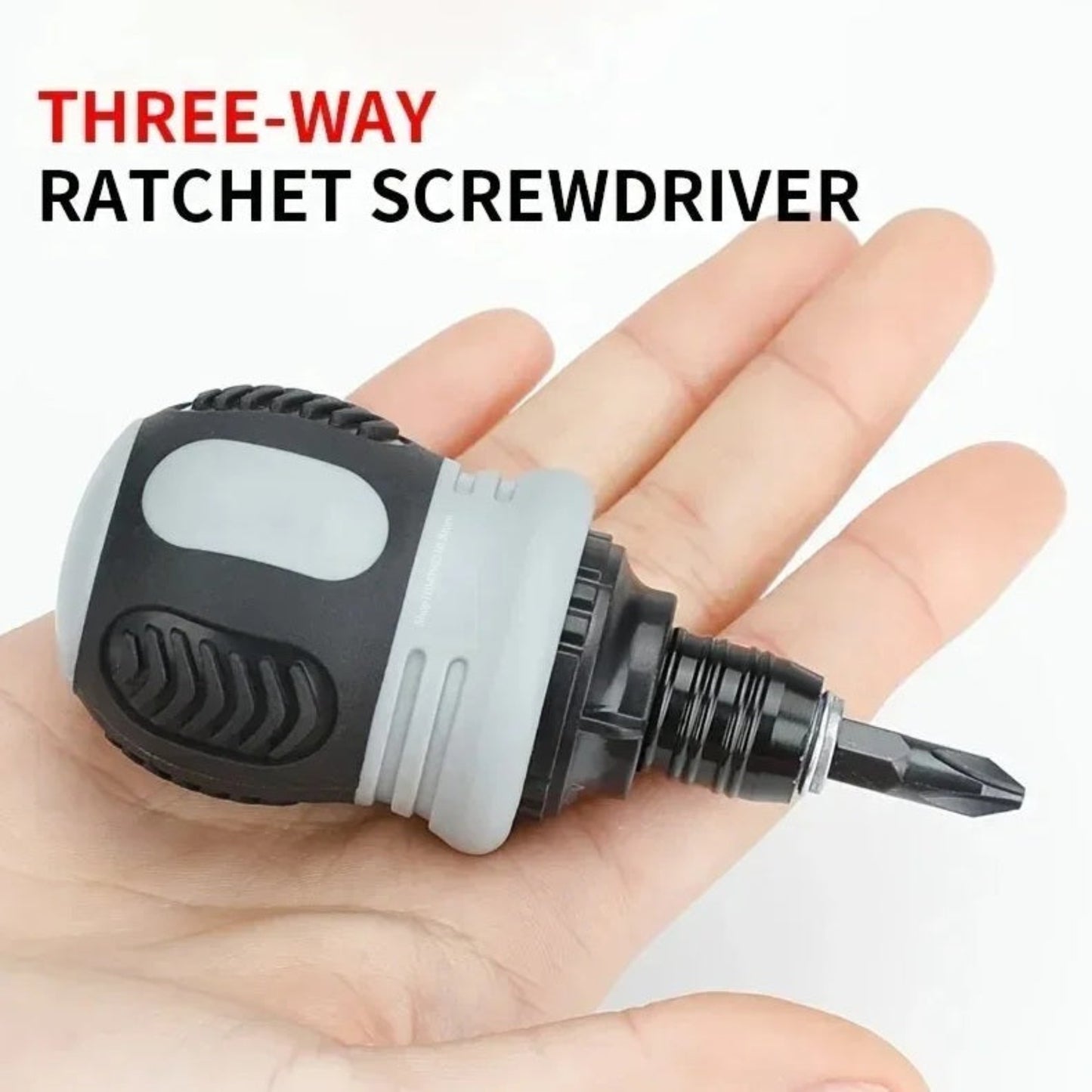 A person holding the compact, stubby three-way ratchet screwdriver in the palm of their hand.