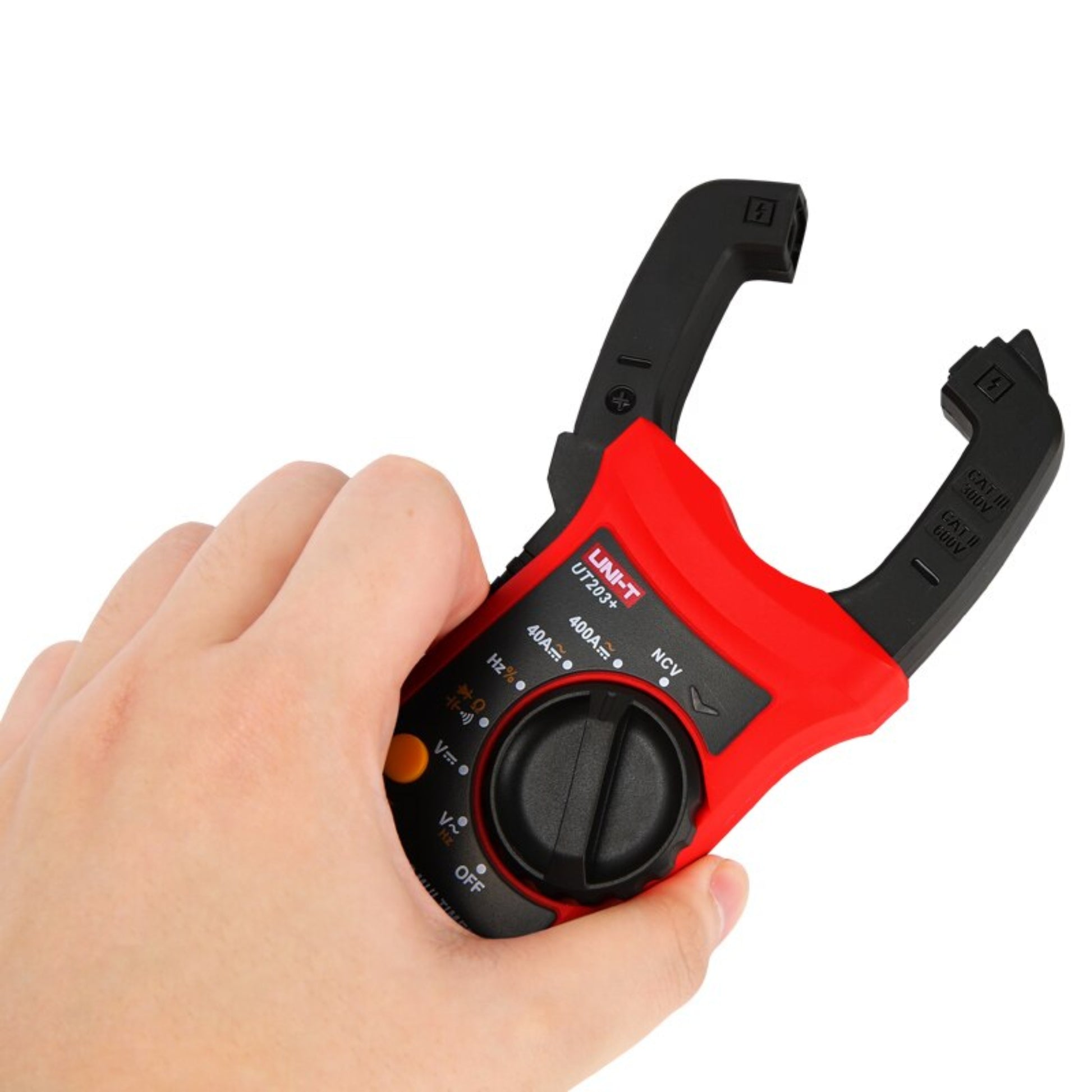 A hand holding the UNI-T UT203+ digital clamp meter to demonstrate its size and ergonomic grip.
