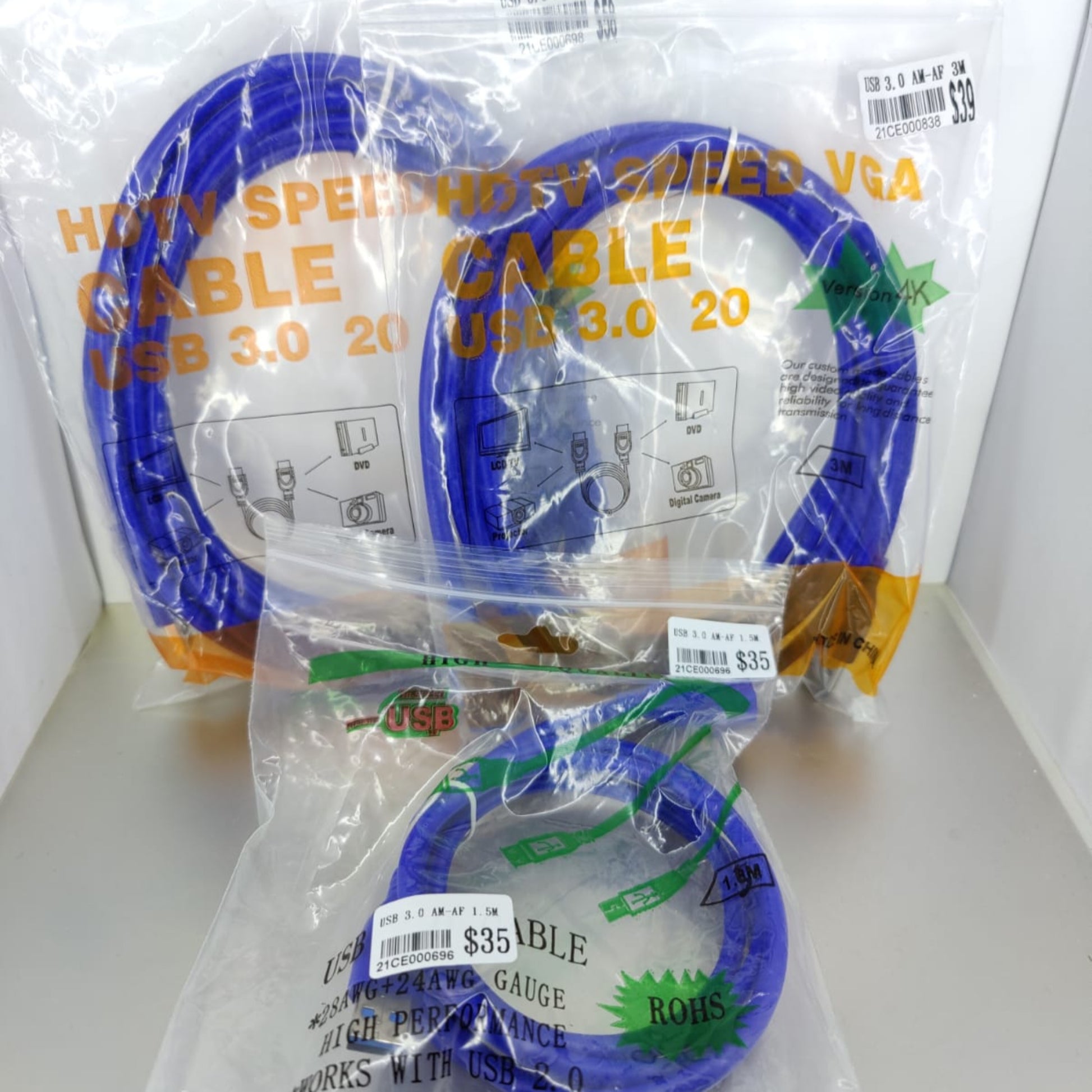 Three packages of high-speed USB 3.0 and VGA cables in blue, showcasing various lengths and price tags.