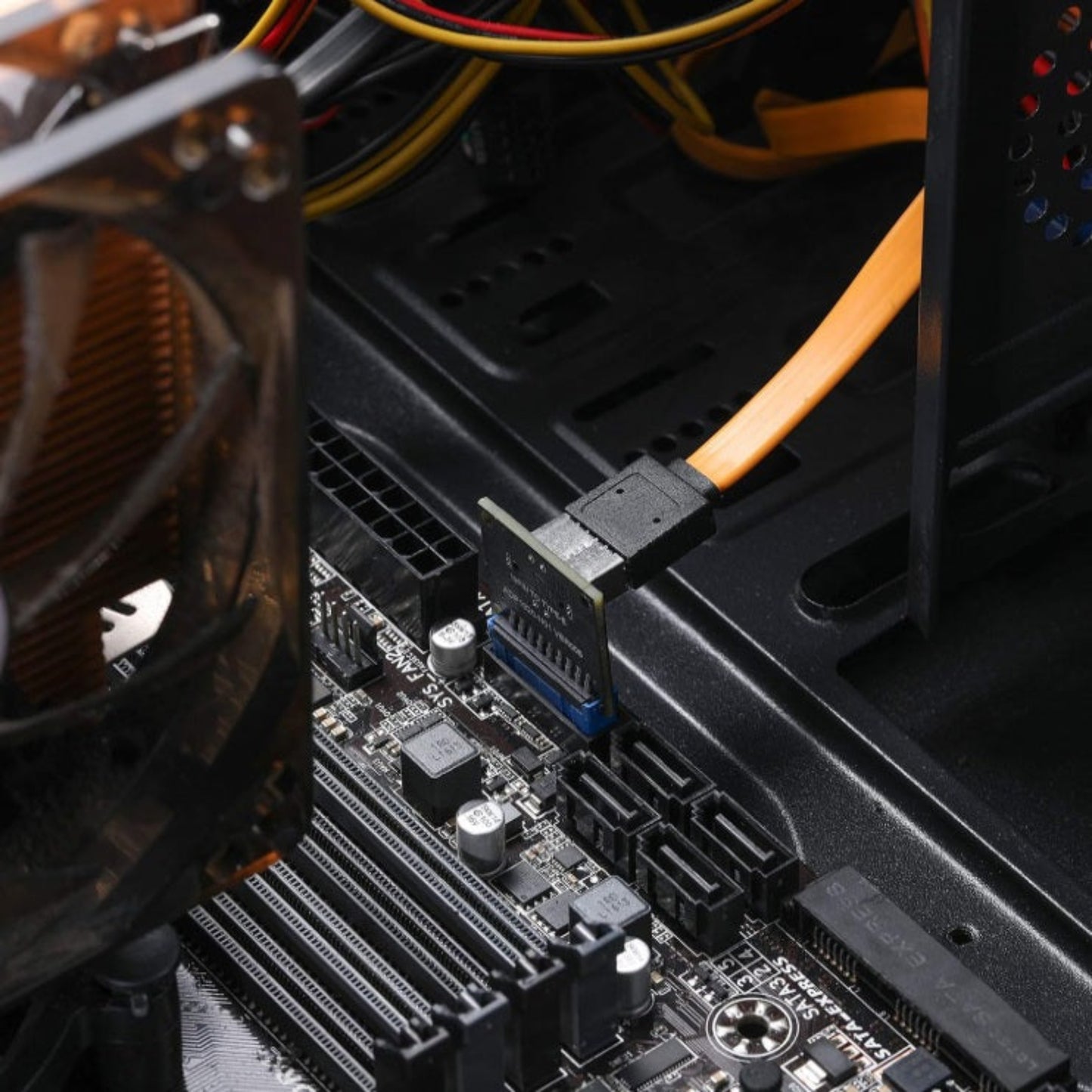 Internal view of the USB 3.0 to Type-E adapter installed on a motherboard with a front panel USB-C cable attached.