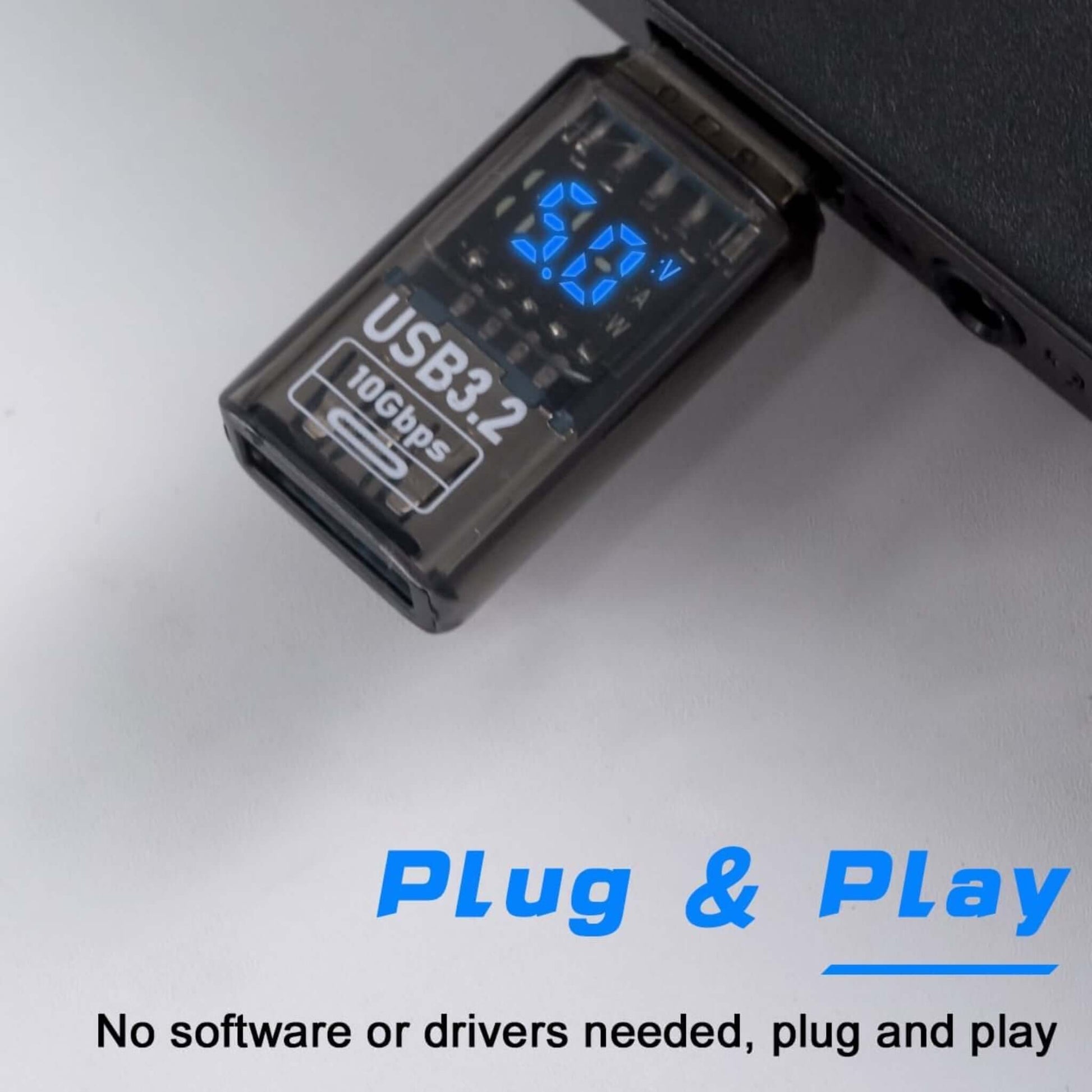 USB 3.2 A to A digital display adapter plugged into a device, emphasizing plug & play function.