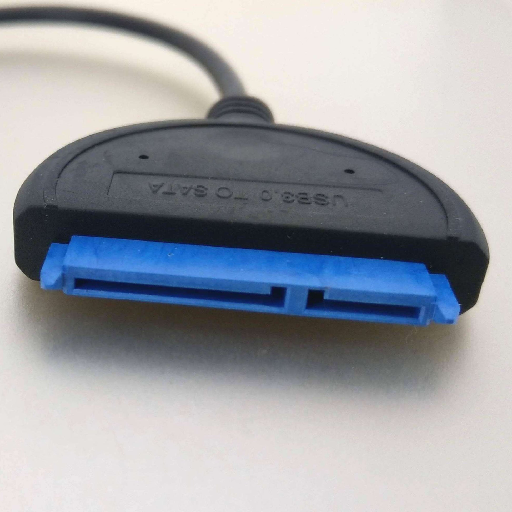Close-up of USB-C to SATA adapter cable connector for 2.5" SSD/HDD, featuring blue and black design.