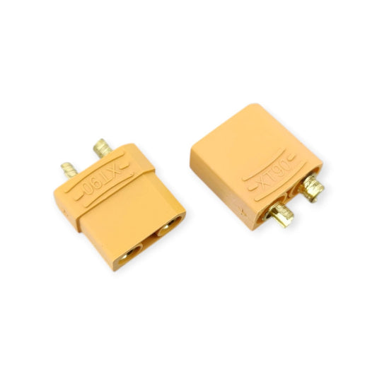A pair of yellow XT90 high-current connectors, showing the male plug and female socket for RC Lipo batteries.