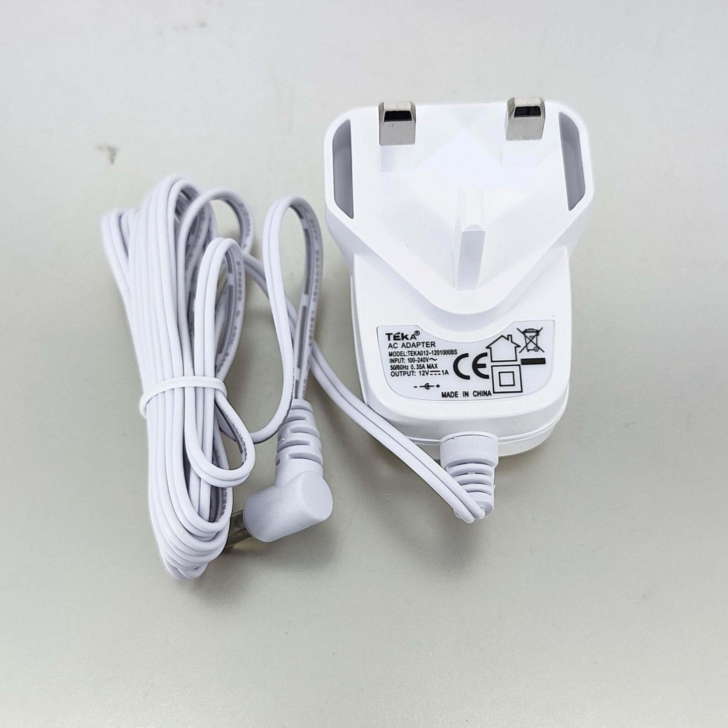 12V 1A DC Power Adapter with UK plug and cable, designed for reliable power supply and charger for devices.