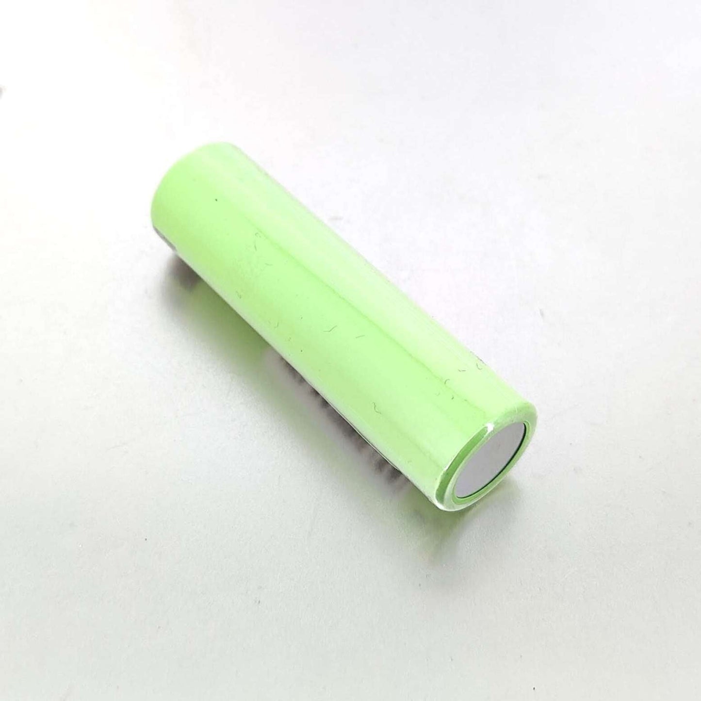 18650 rechargeable battery 3.7V Li-ion with a green casing for LED flashlights and other devices.