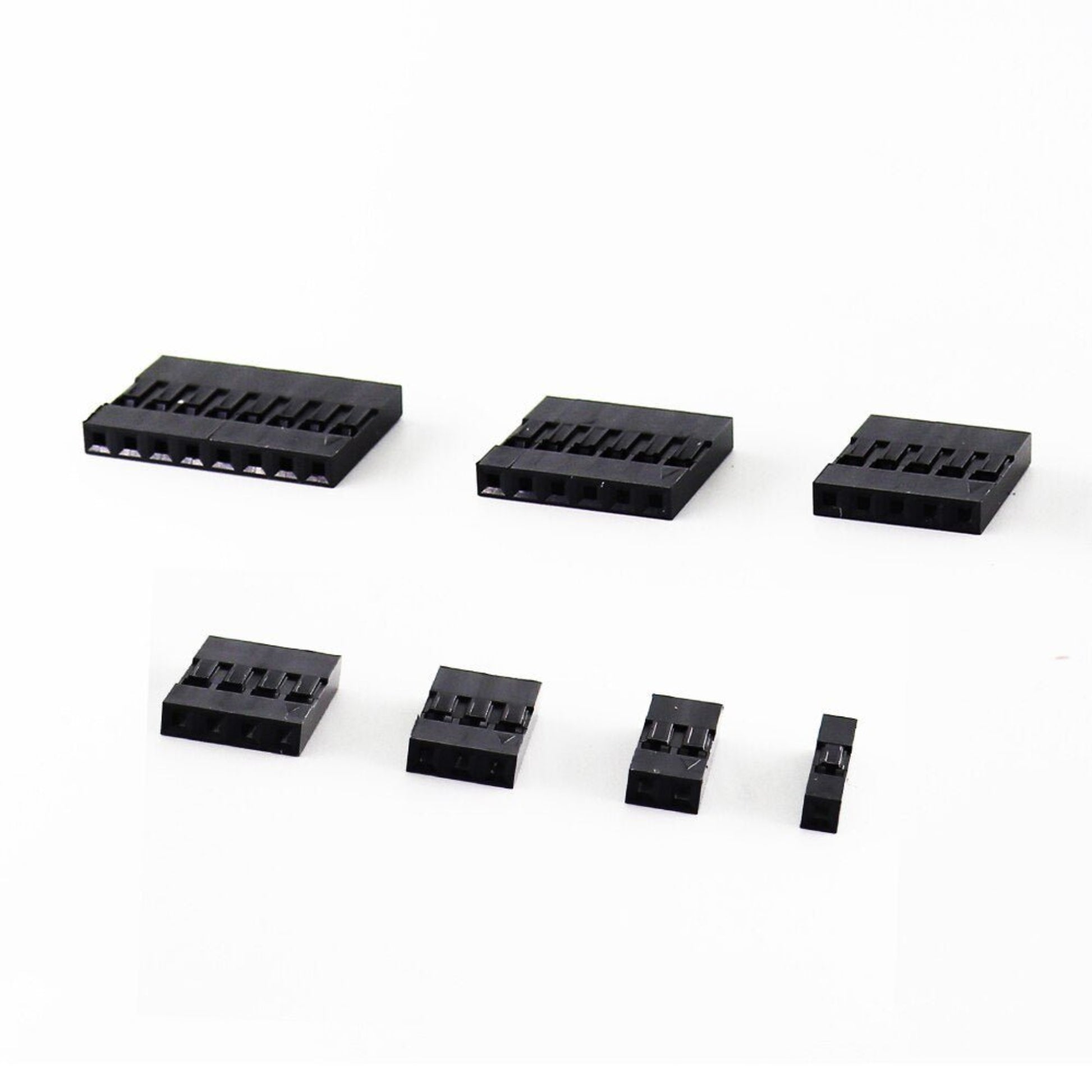 Variety of black 2.54mm Dupont connector housing blocks in different sizes for DIY electronics projects.