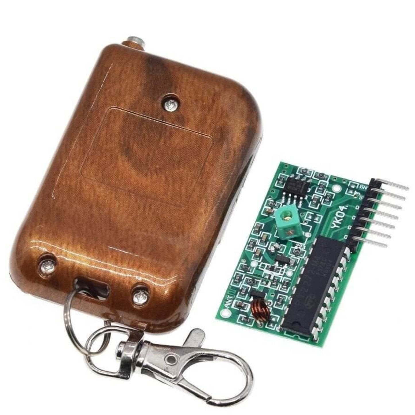 Close-up of 2262 2272 4-channel wireless remote module kit, showing transmitter back and ASK decoding receiver board.