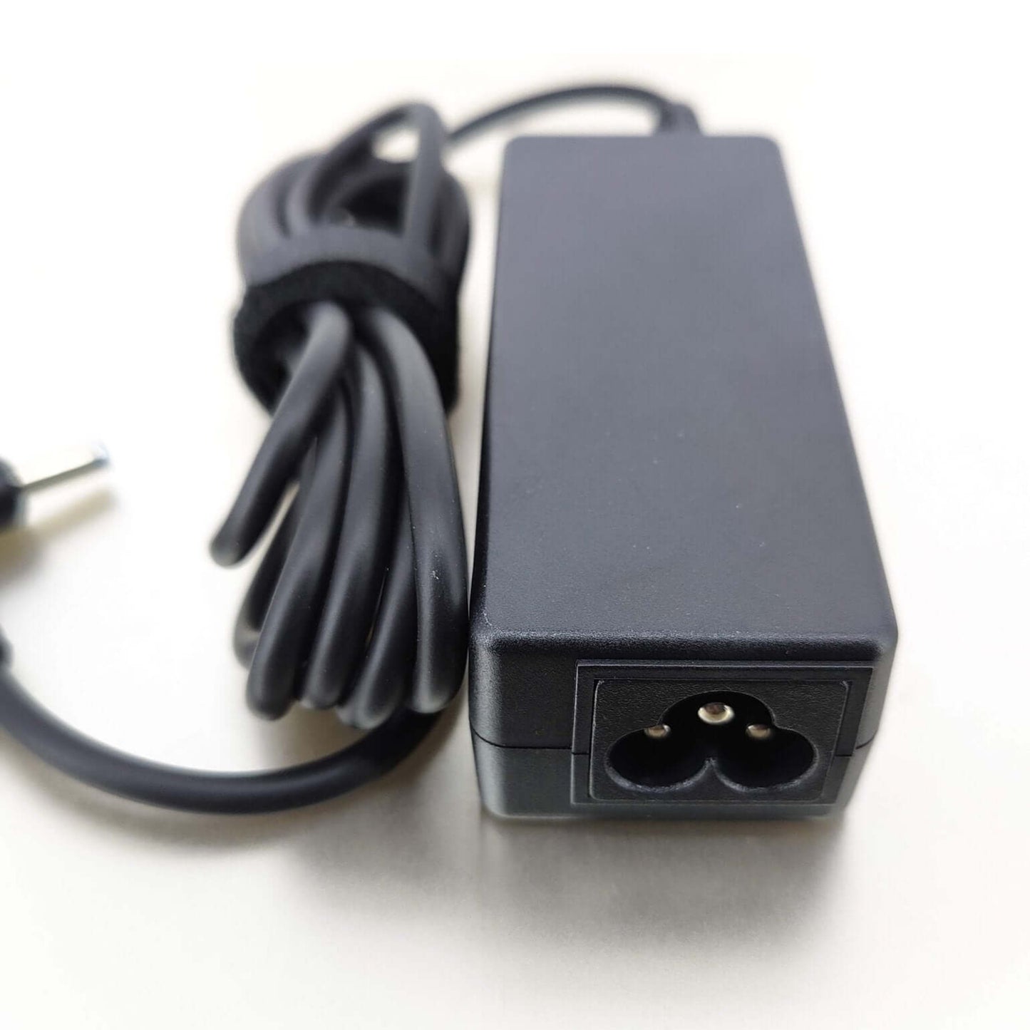 HP 45W 19.5V 2.31A Laptop Charger with 4.5x3.0mm Connector power adapter close-up image.