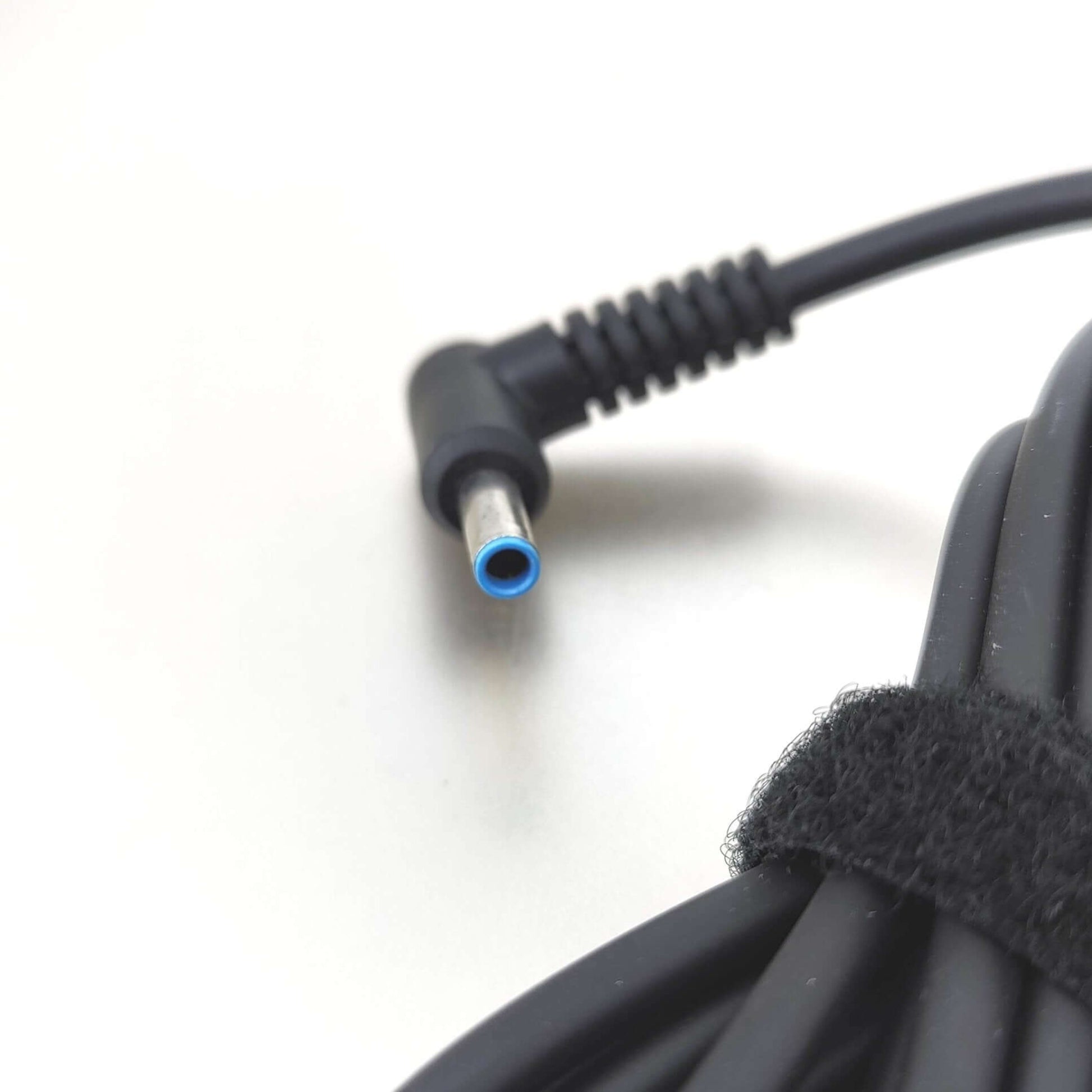 HP 45W 19.5V 2.31A Laptop Charger with 4.5x3.0mm Connector blue-tipped cable end close-up.