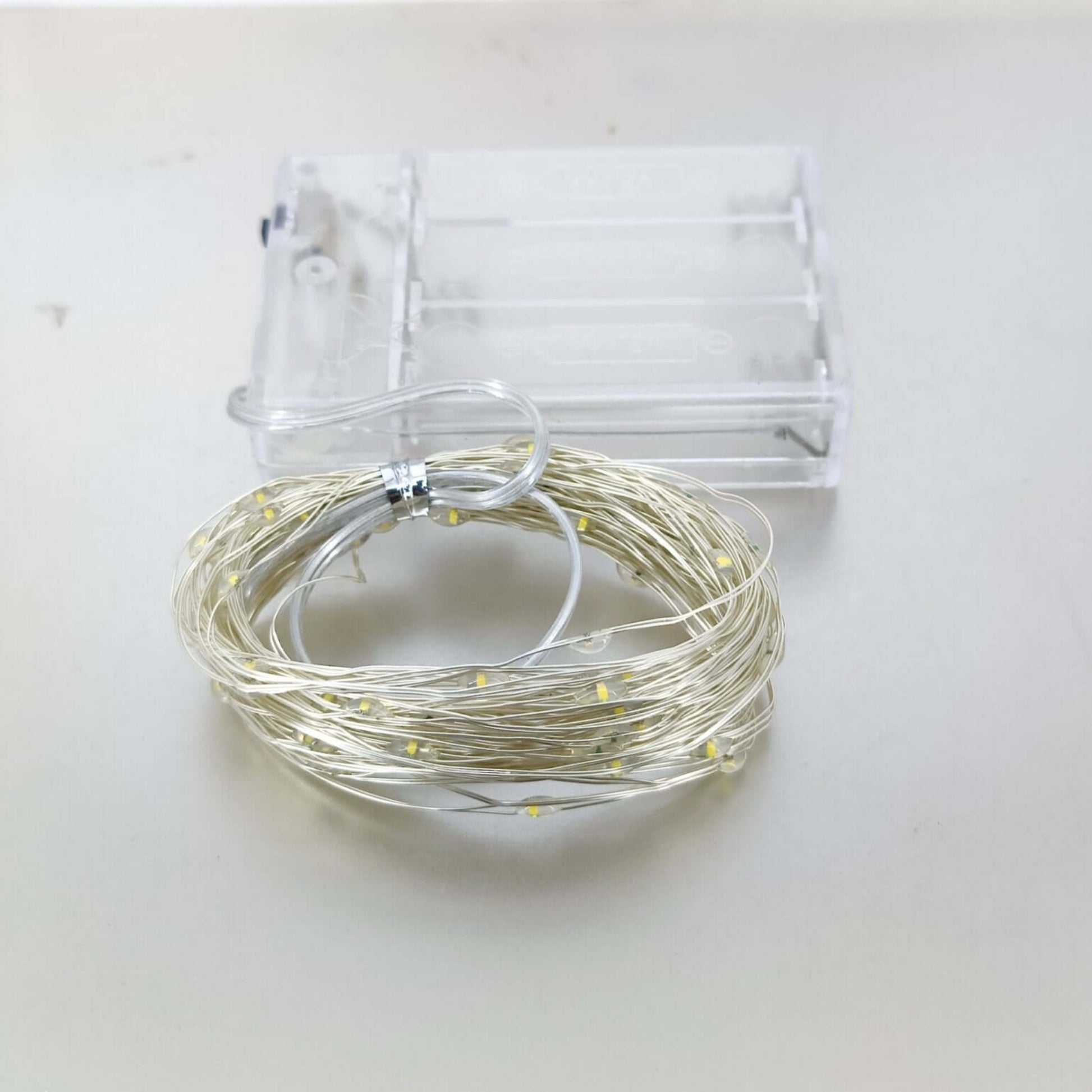 Warm white LED string light with battery case for indoor/outdoor decoration.