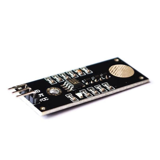 A38 Touch Sensor Module top view showing gold induction pad and LM393 chip.