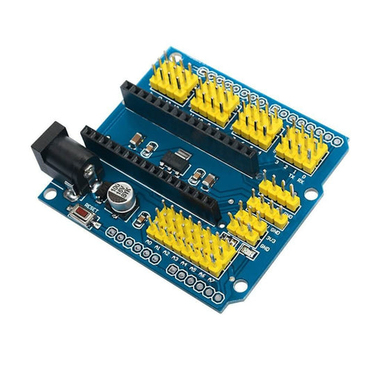 Angled view of Arduino Nano I/O expansion shield showing yellow headers and DC power jack.