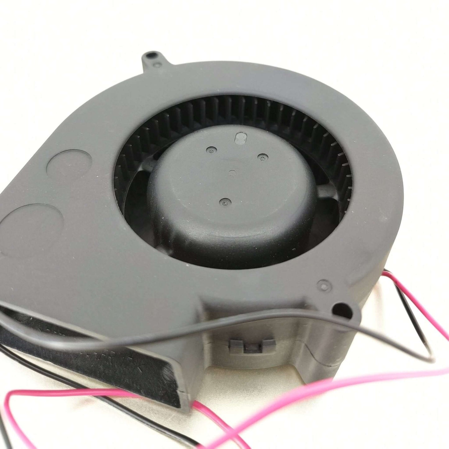Delta BFB1024H 24V cooling fan from above with black casing and wires, designed for efficient air flow.