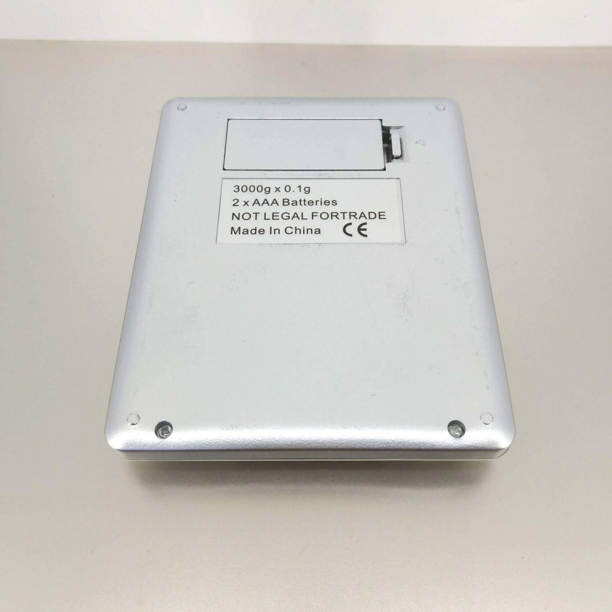 Back view of High Precision Digital Pocket Scale, 3000g capacity, 0.1g accuracy, powered by 2 AAA batteries.