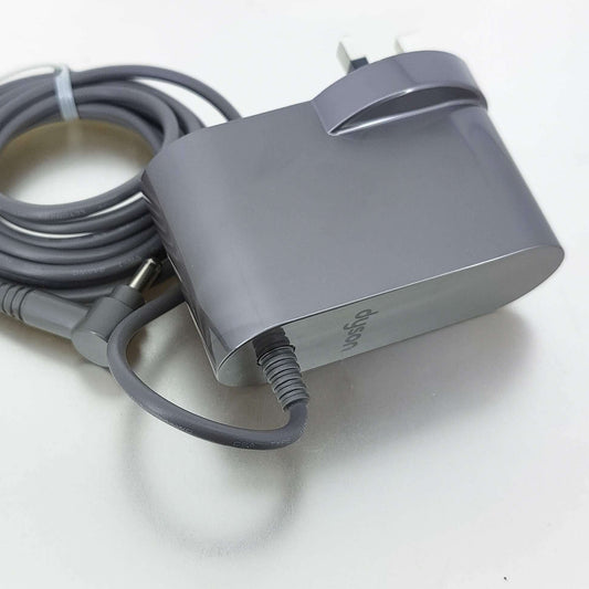 Grey UK plug charger for Dyson V10, V11, V12, and V15 vacuum cleaners.
